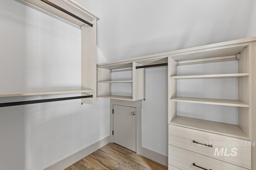 Walk in closet featuring light wood-type flooring