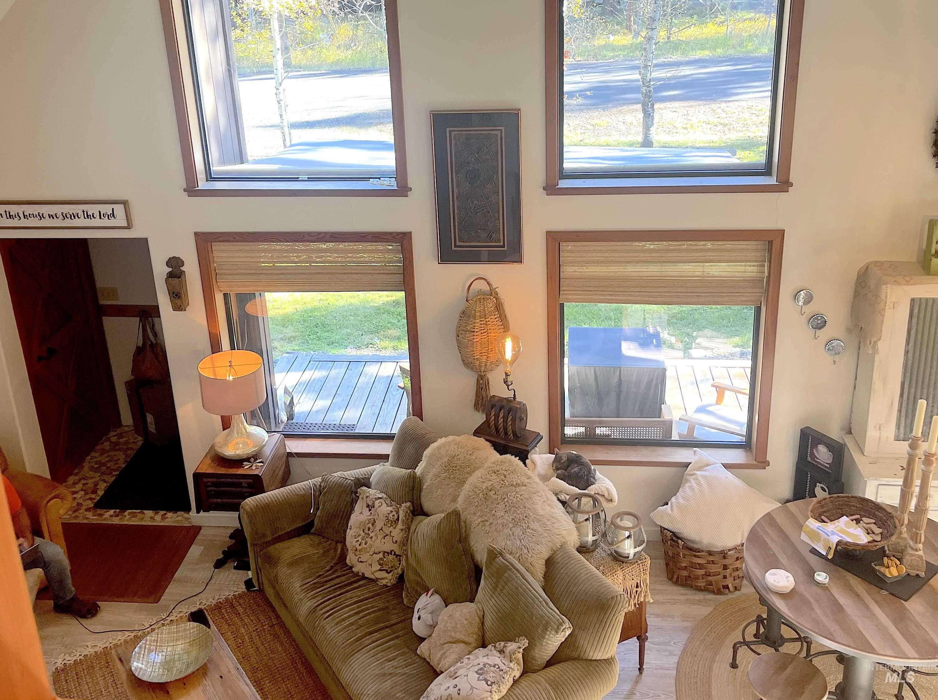 Living room with healthy amount of natural light and wood finished floors