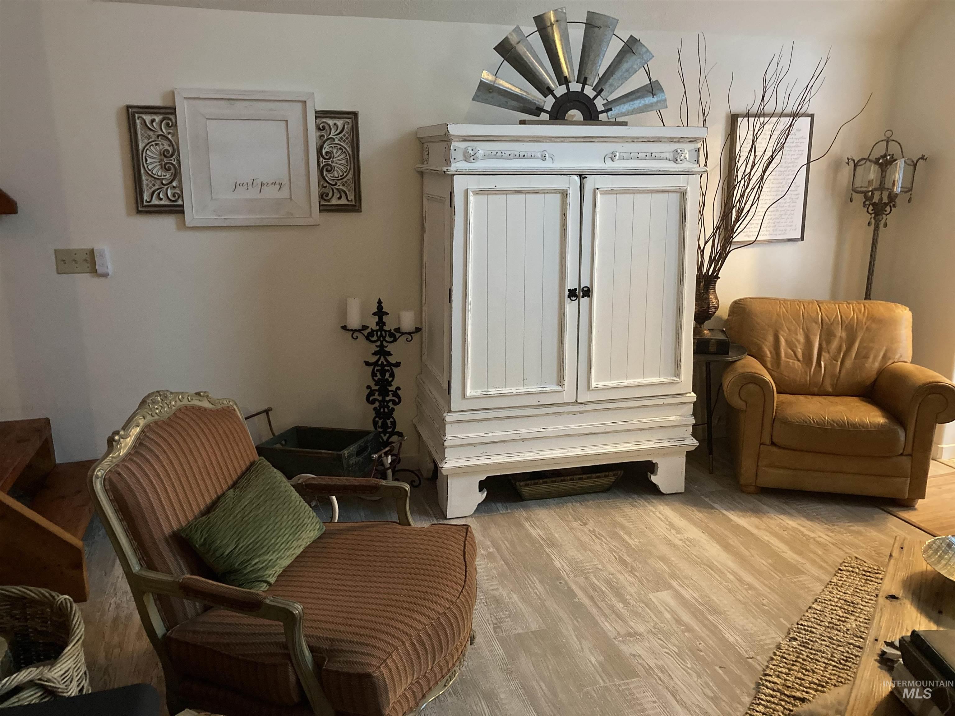 Sitting room featuring wood finished floors