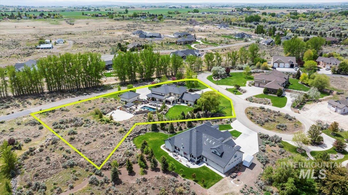 Aerial perspective of suburban area with property parcel outlined