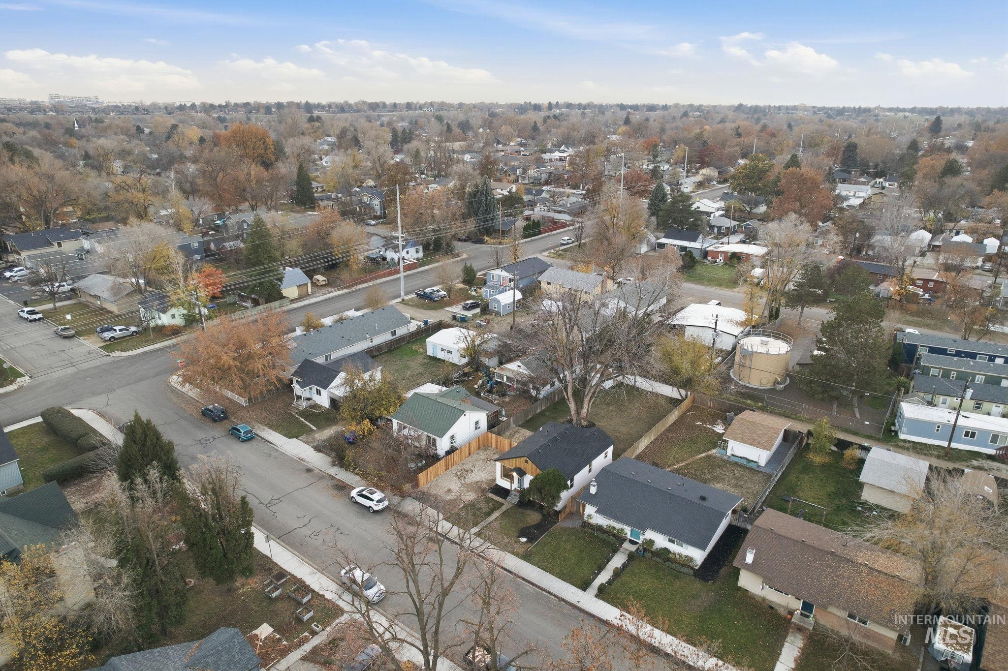Aerial overview of property's location featuring nearby suburban area