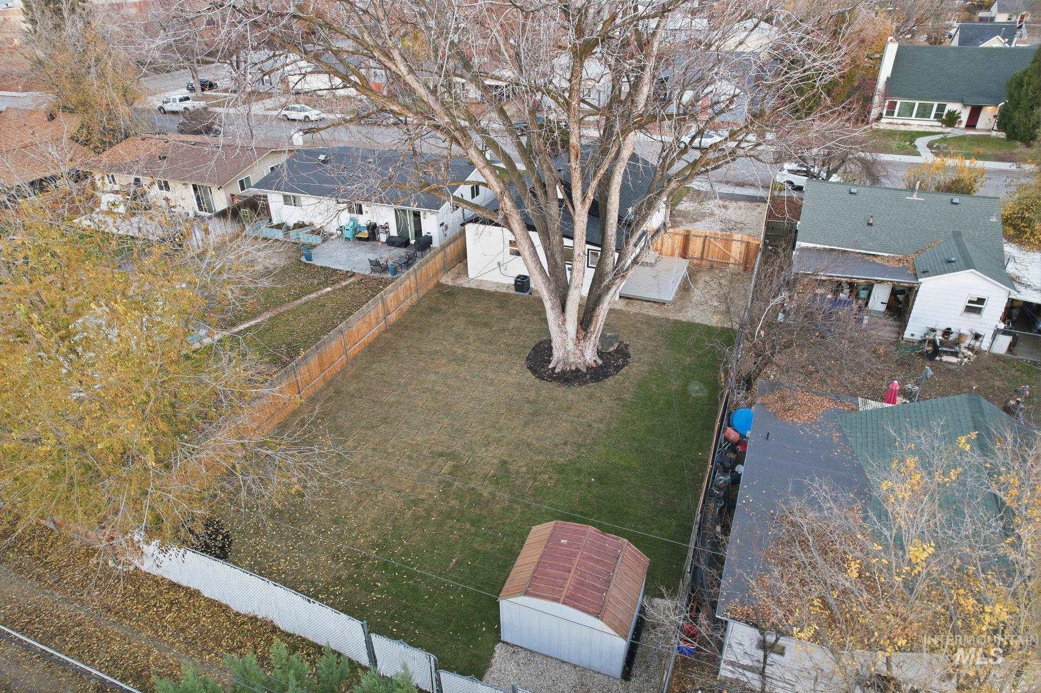 Aerial overview of property's location featuring nearby suburban area