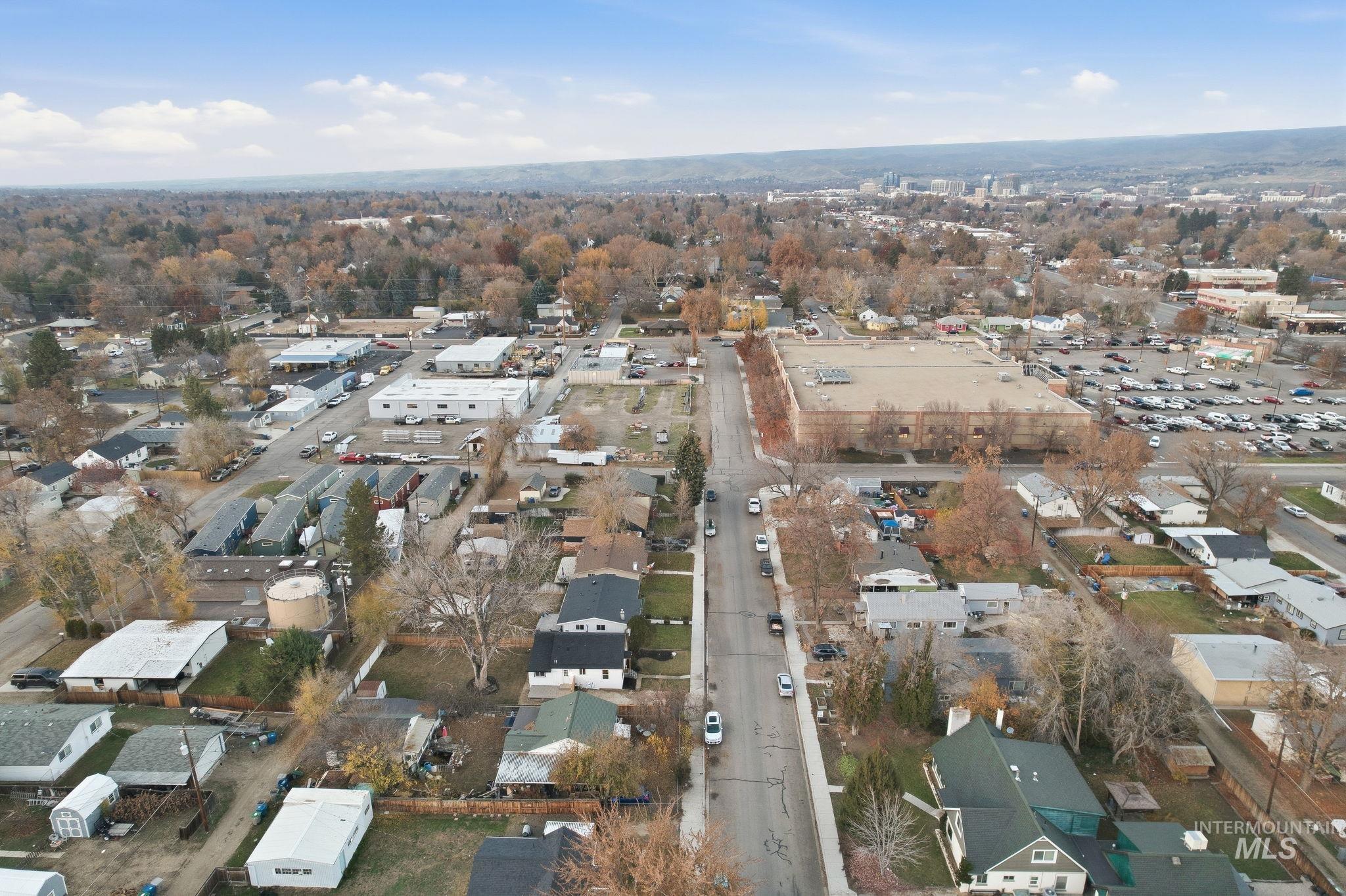 View of property location with nearby suburban area