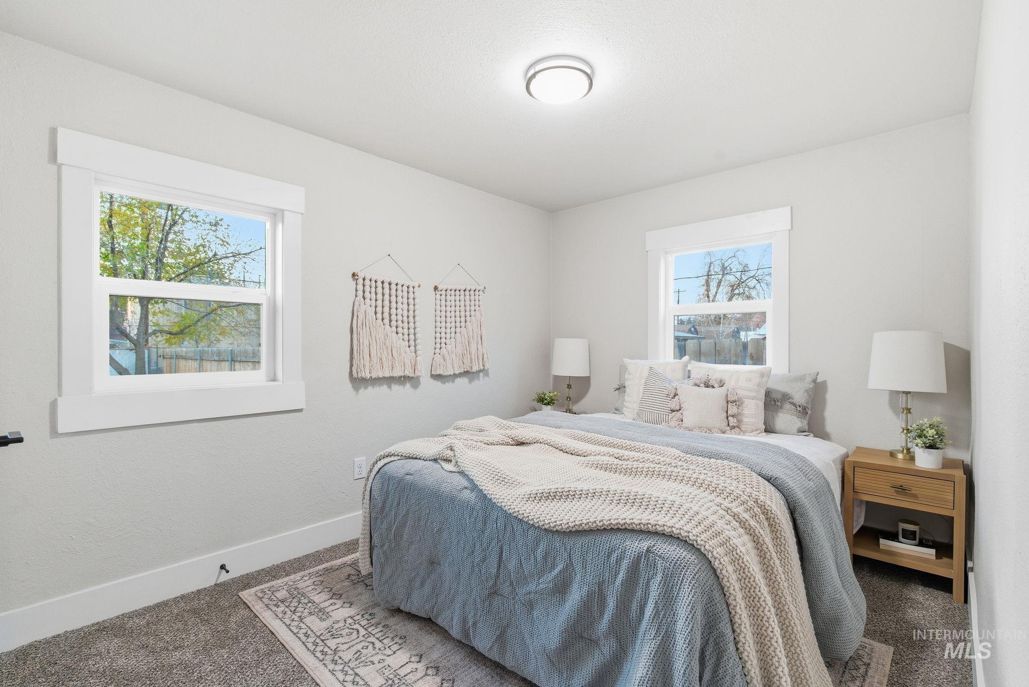 Carpeted bedroom with baseboards