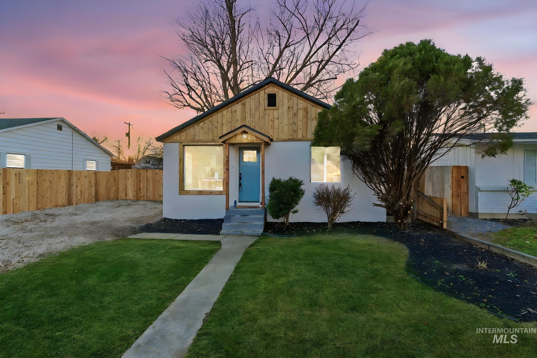 View of front facade featuring stucco siding