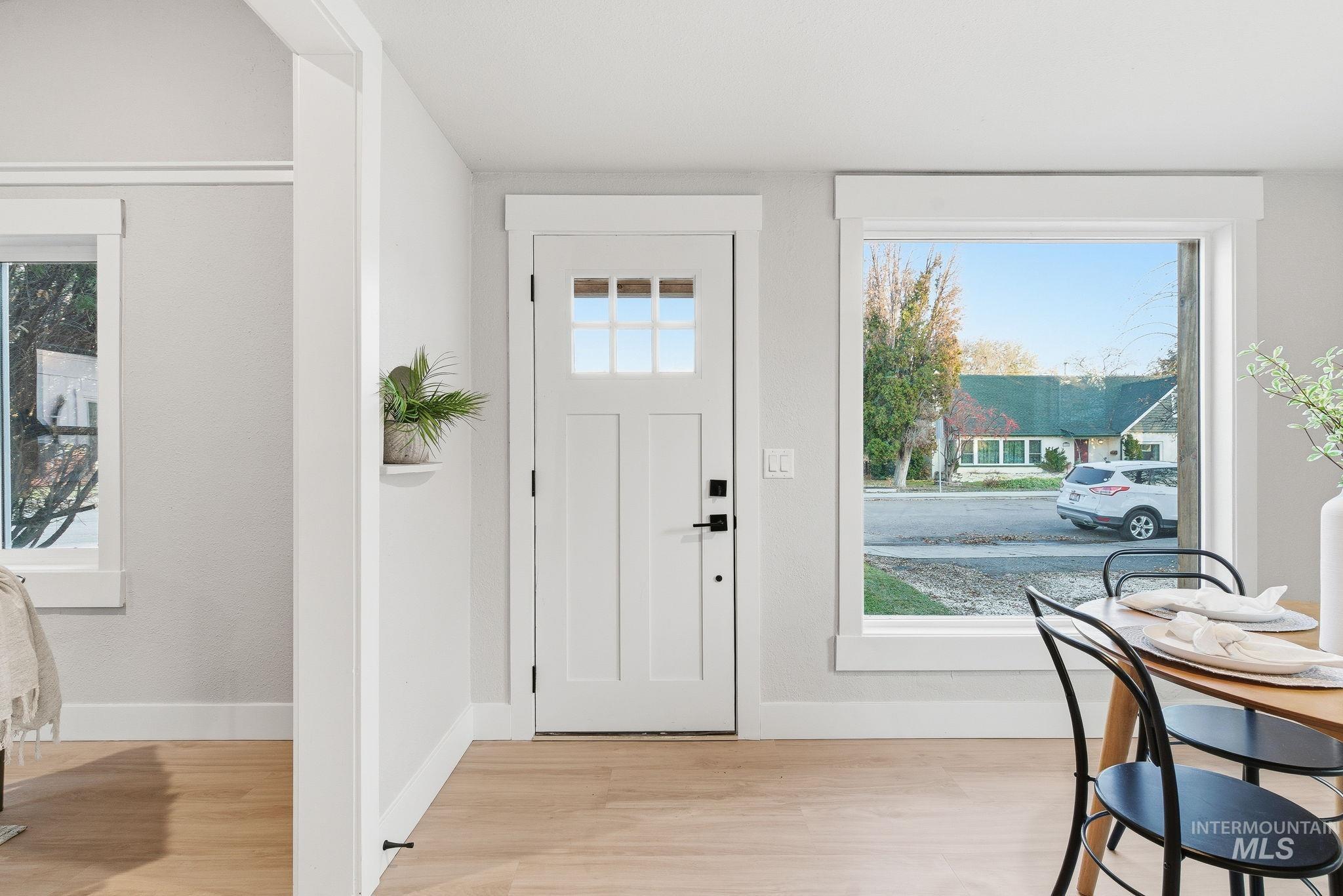 Foyer entrance featuring light wood-style floors