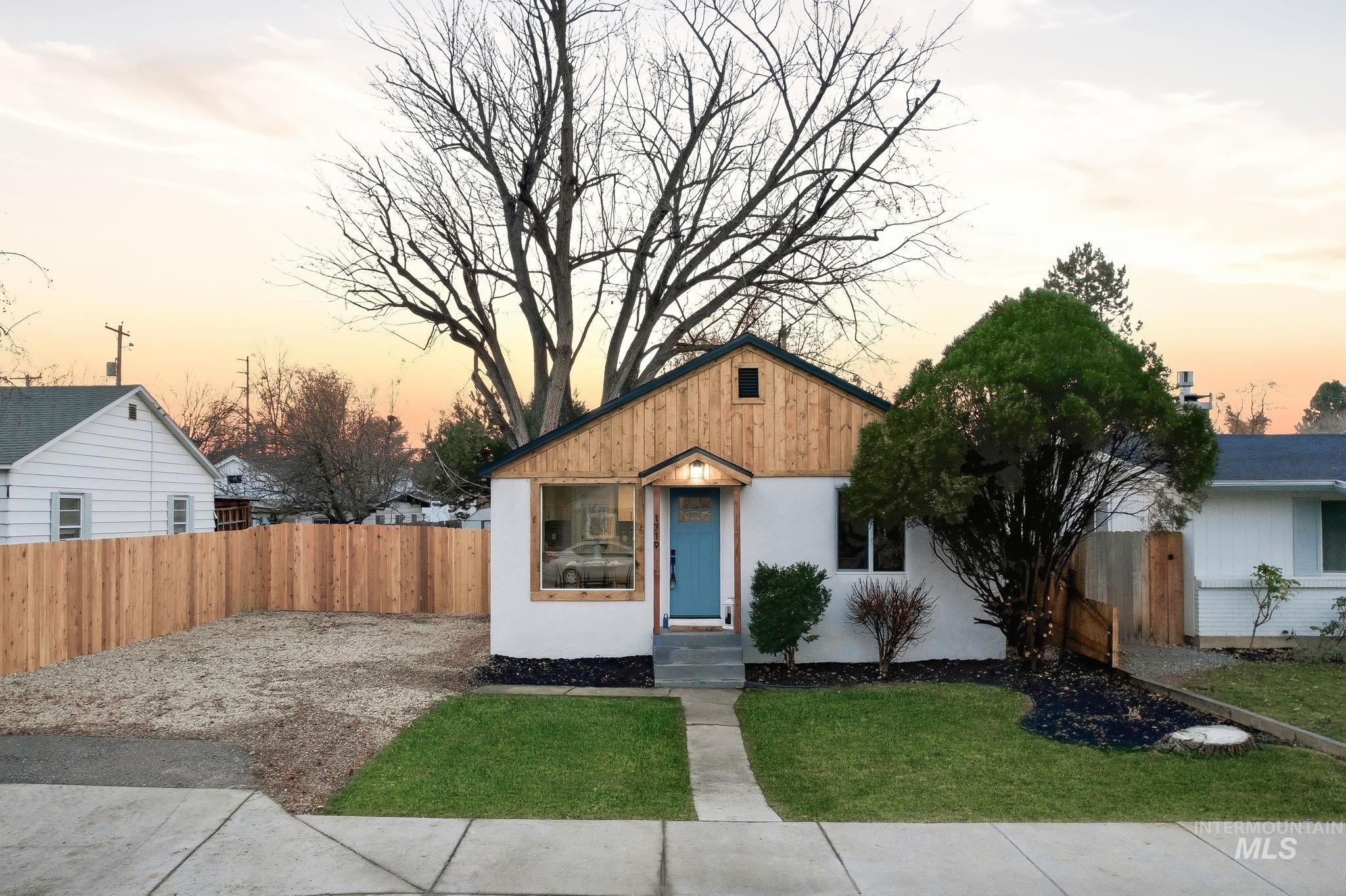 View of front of home featuring stucco siding