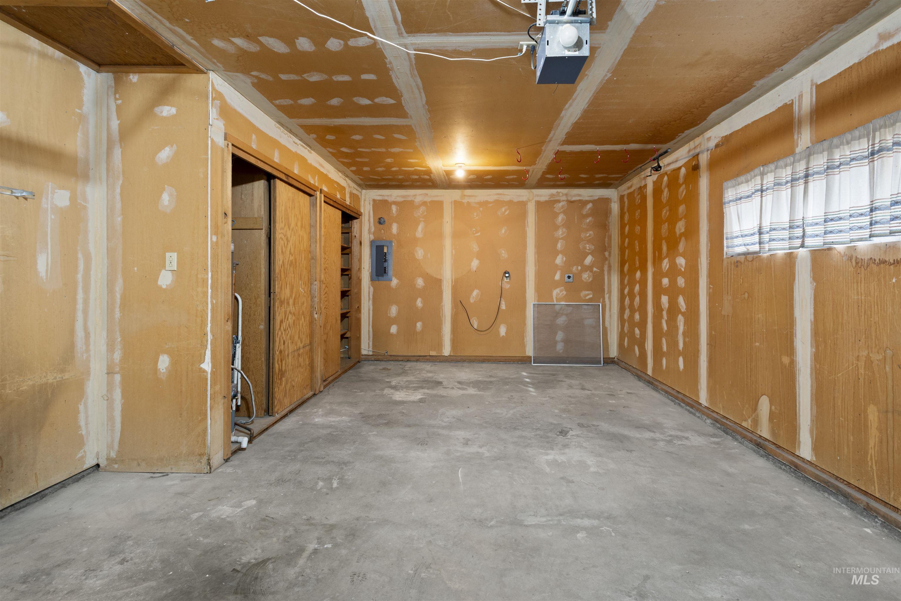 Storage room featuring electric panel