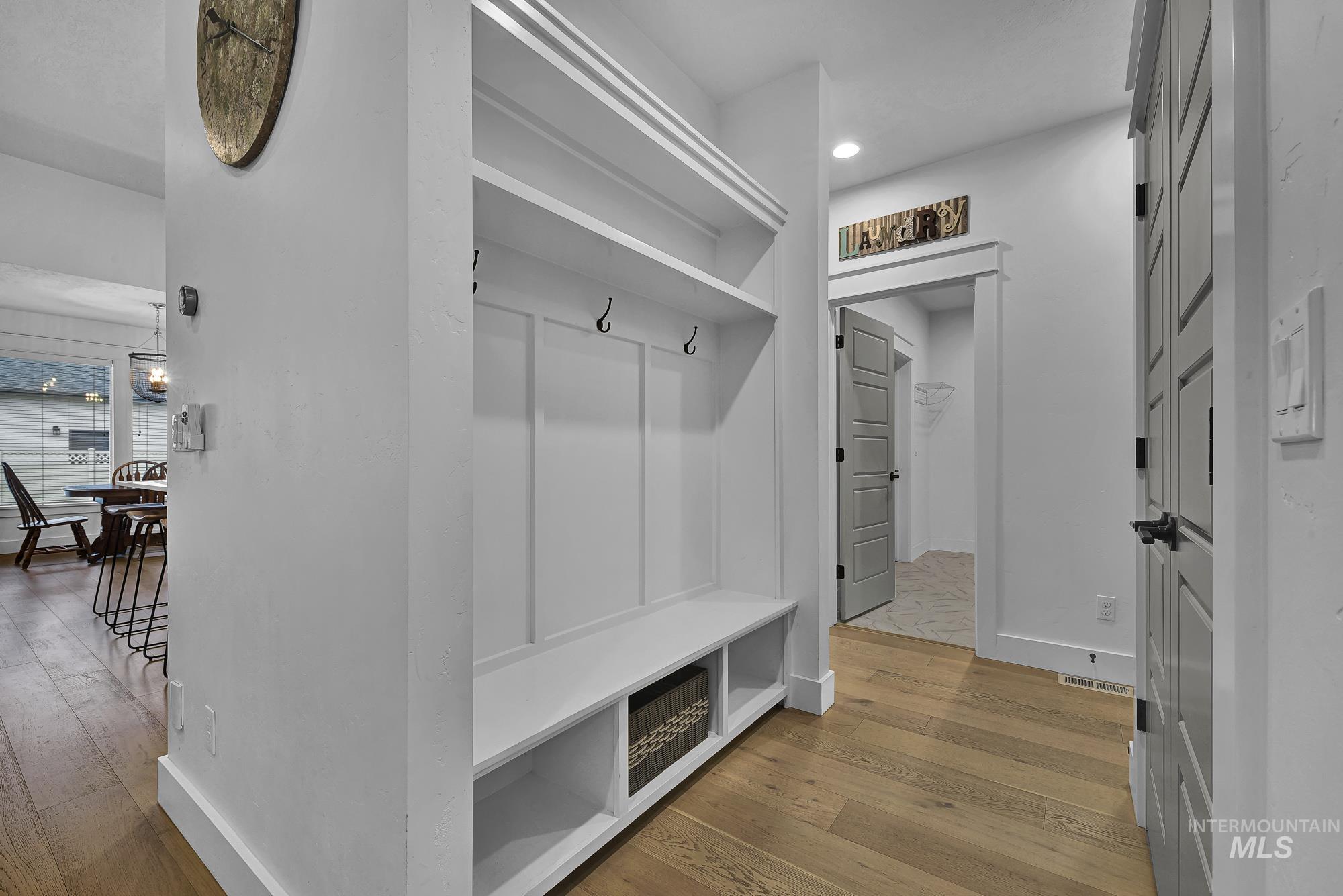 Mudroom featuring light wood-type flooring and recessed lighting