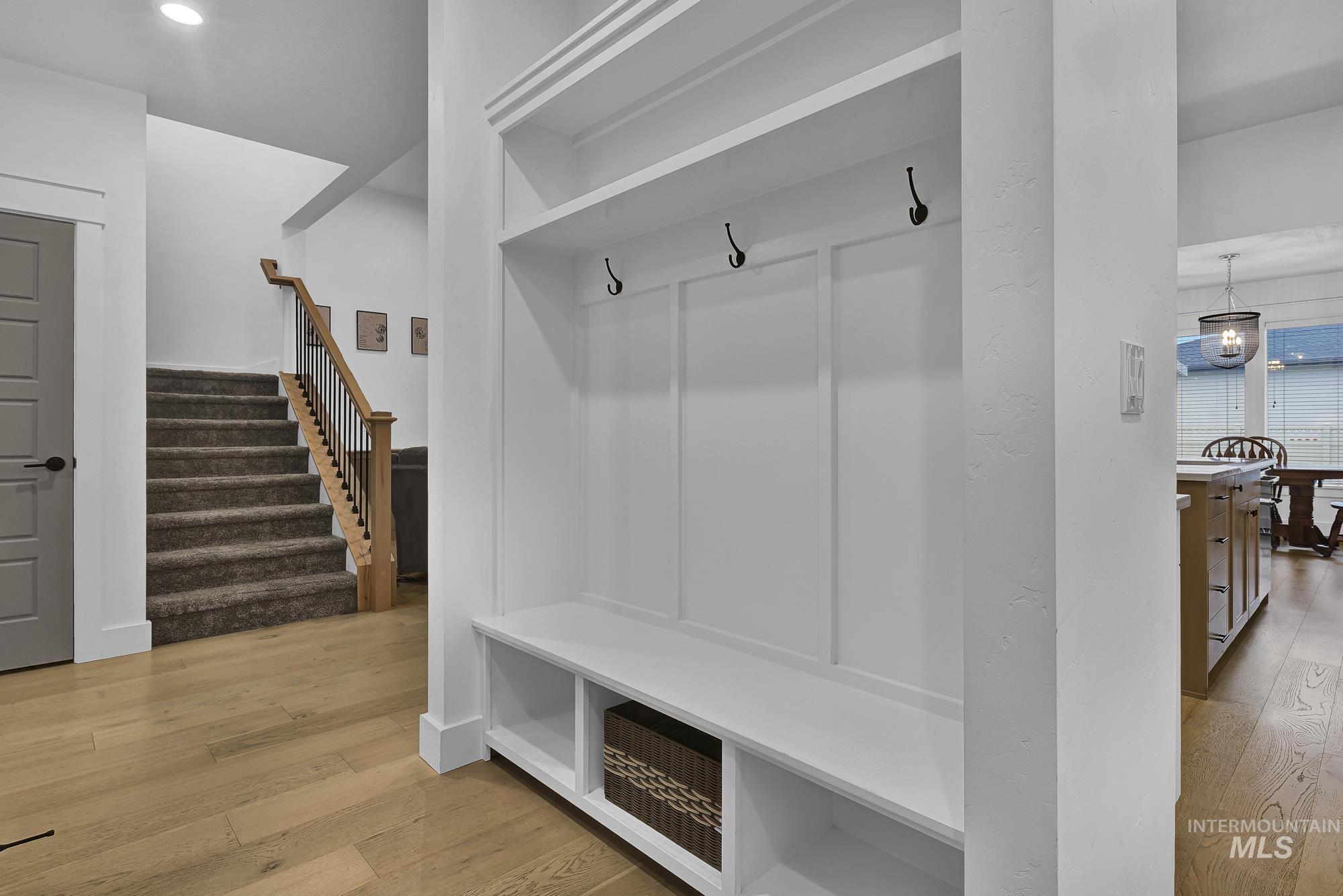 Mudroom featuring light wood finished floors and recessed lighting
