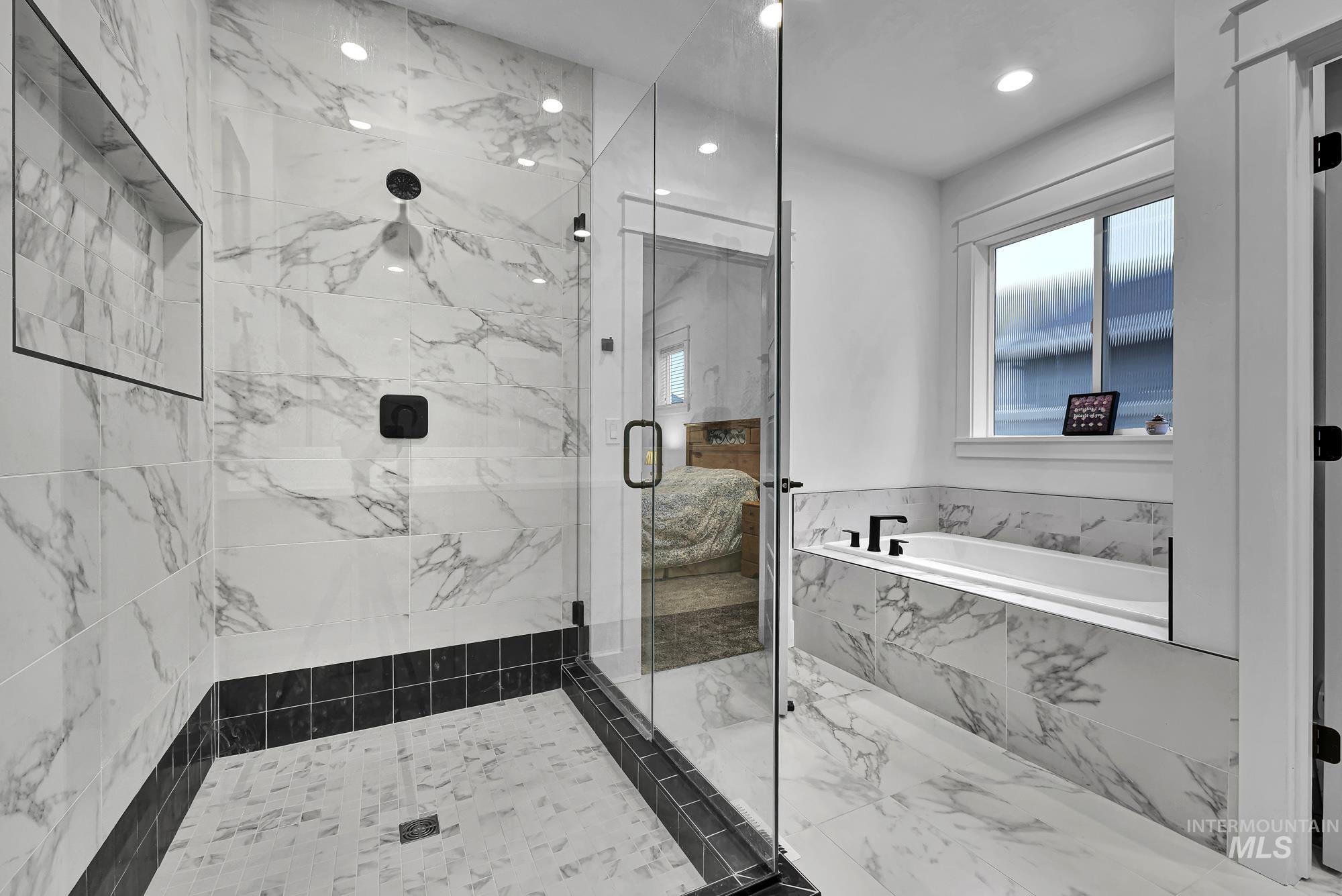 Full bathroom with a garden tub, a marble finish shower, marble finish flooring, and recessed lighting