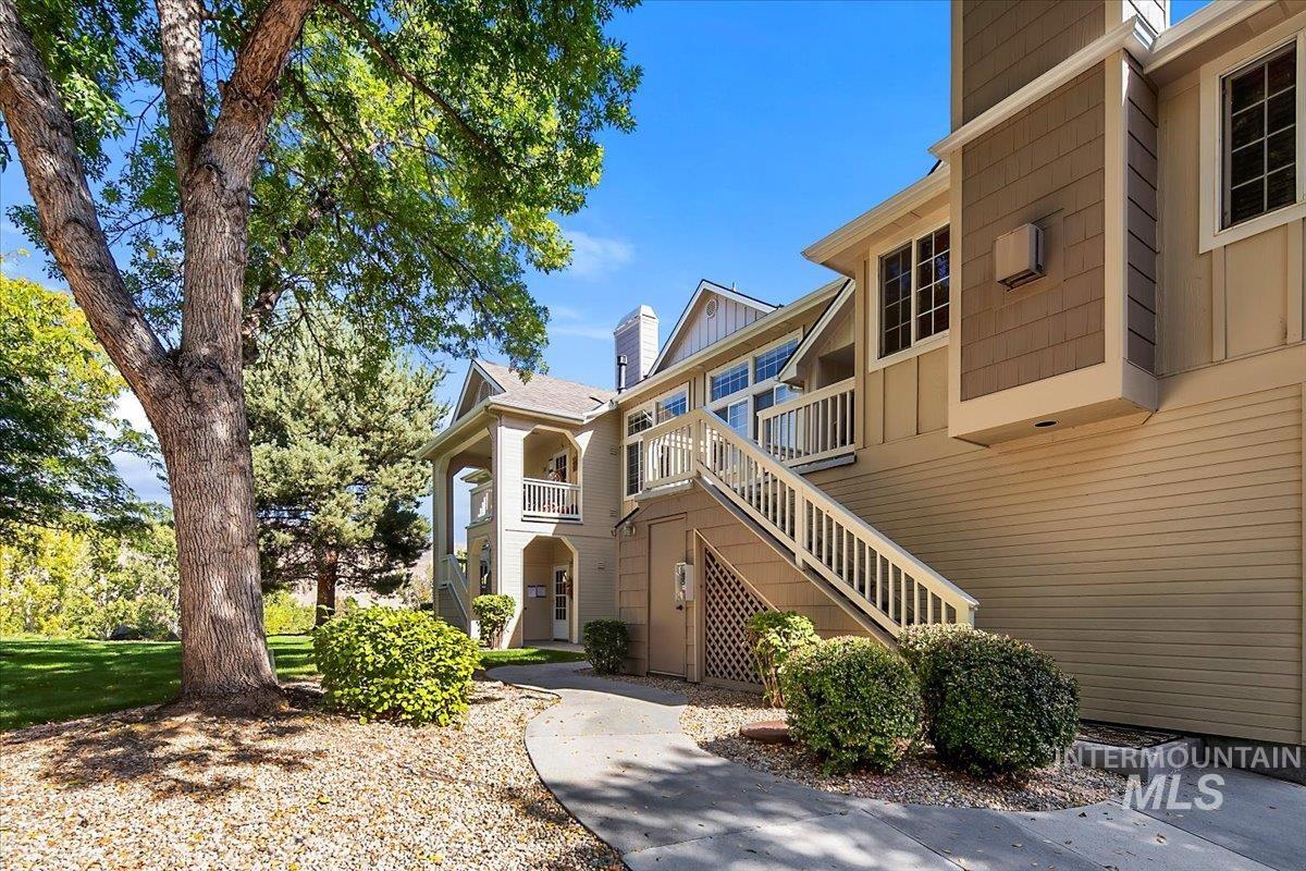 Flight of stairs up to entry balcony to front door