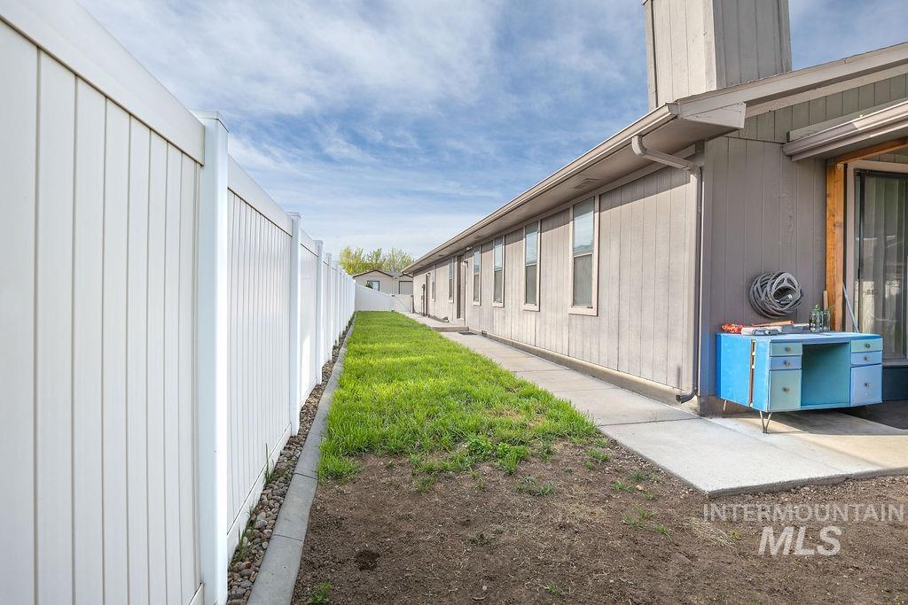 View of side of property with a fenced backyard