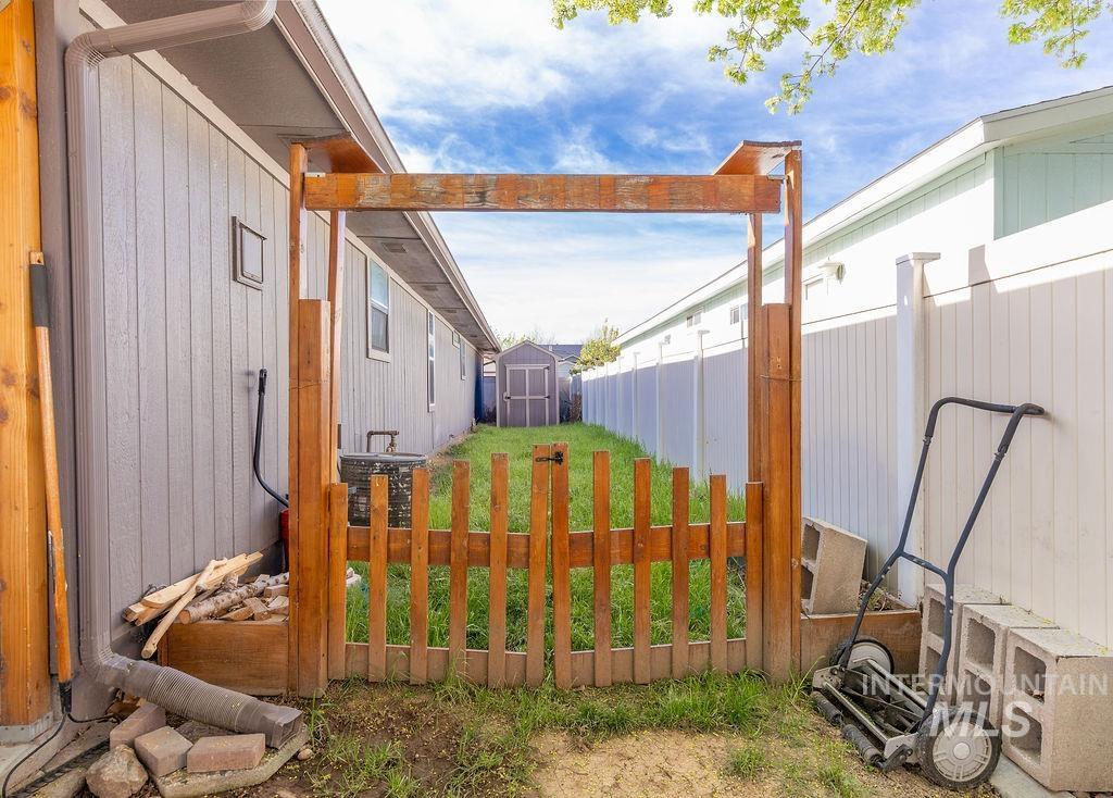 Fenced yard with a storage unit