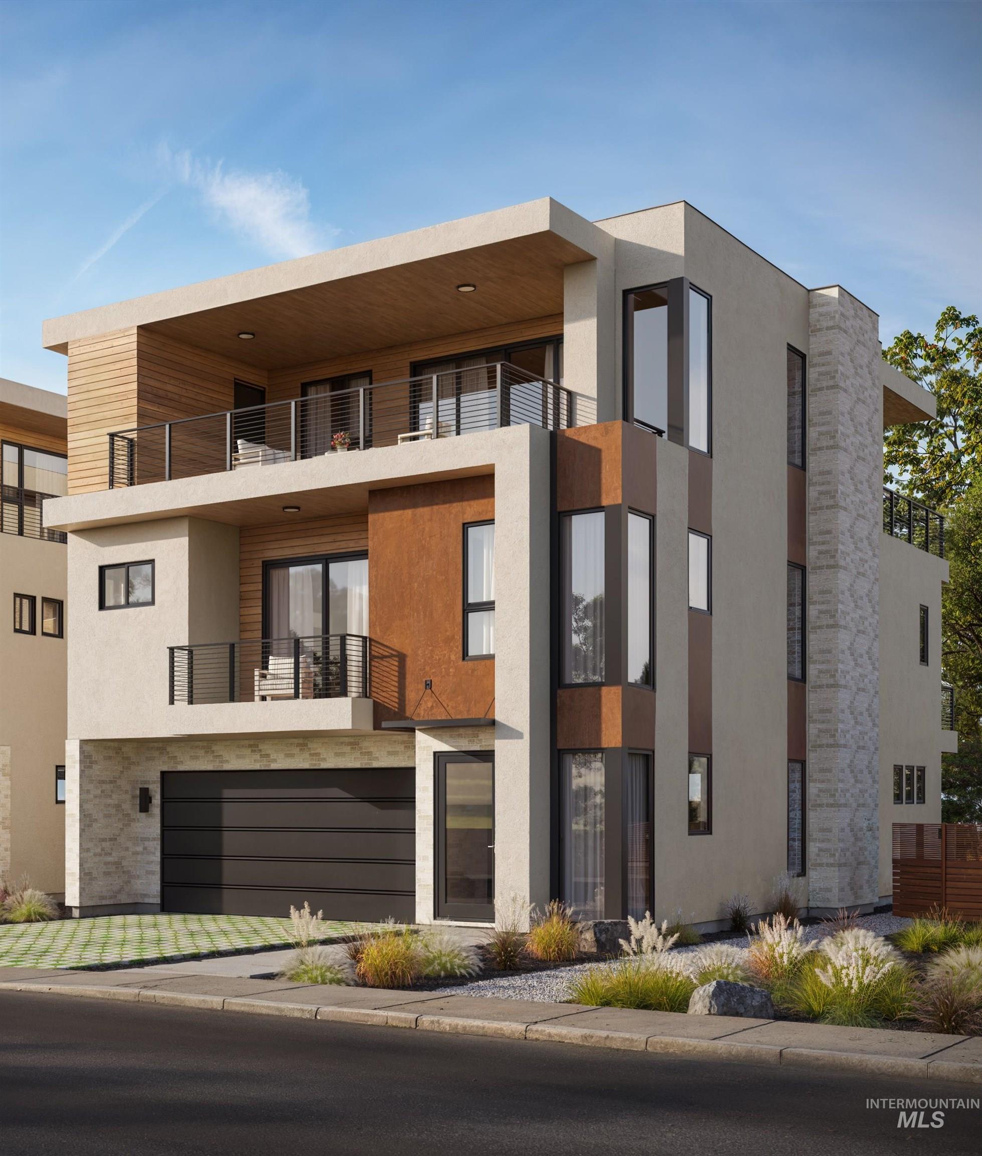 View of front of home featuring stucco siding, a balcony, and stone siding