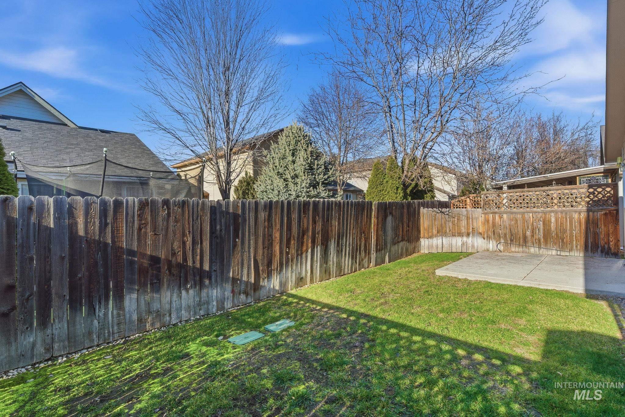 View of fenced backyard