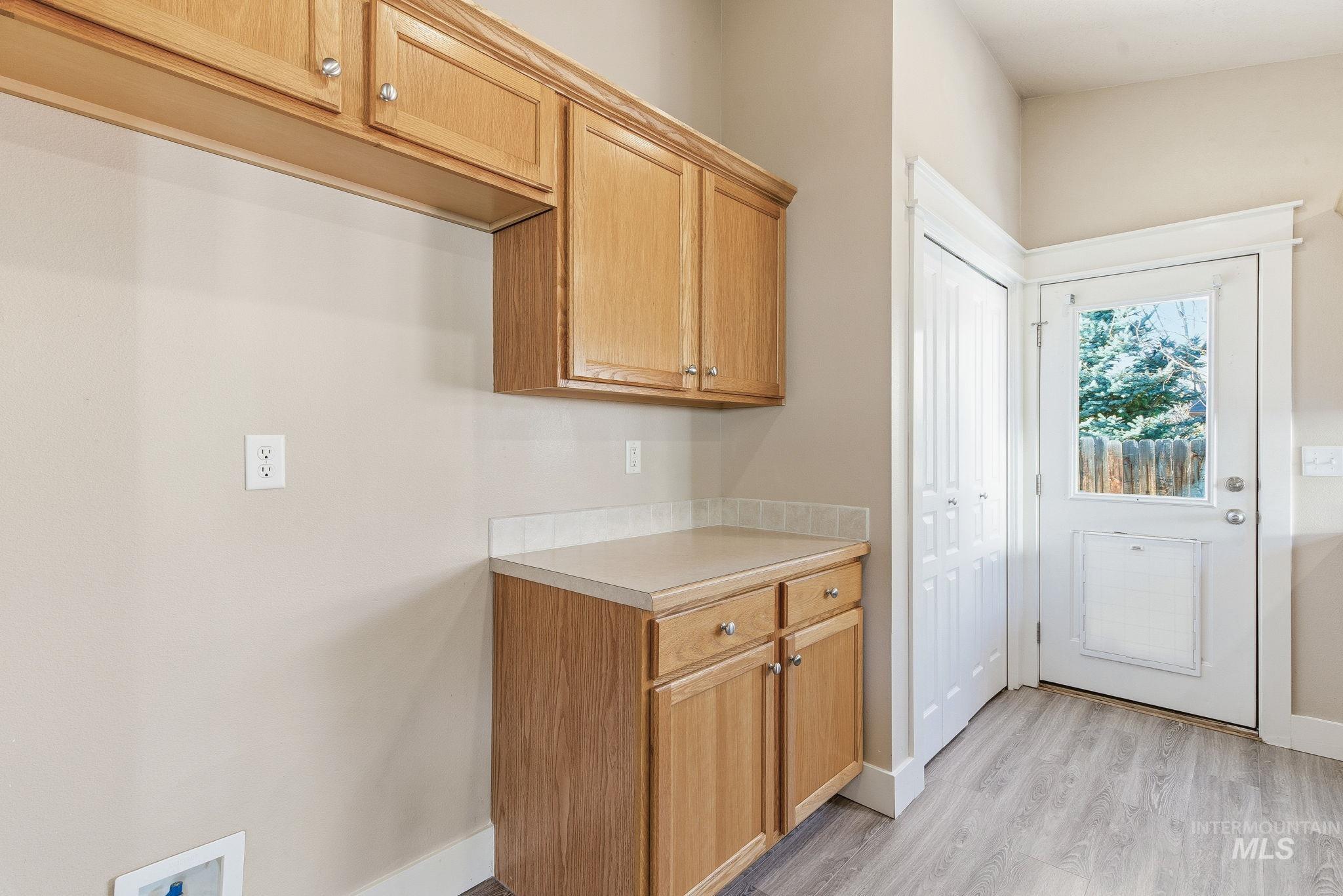 Kitchen featuring light countertops and light wood-style floors