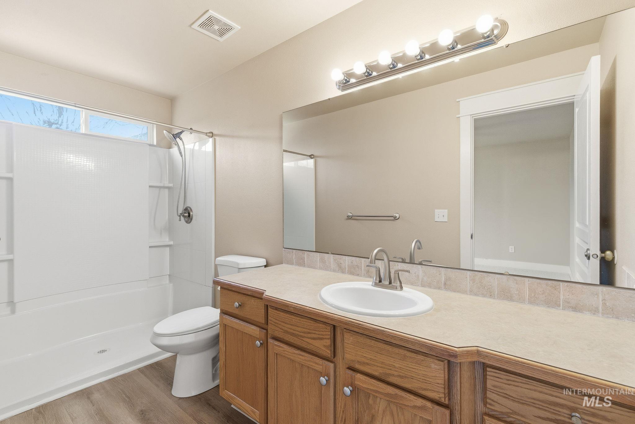 Bathroom featuring vanity and light wood-type flooring