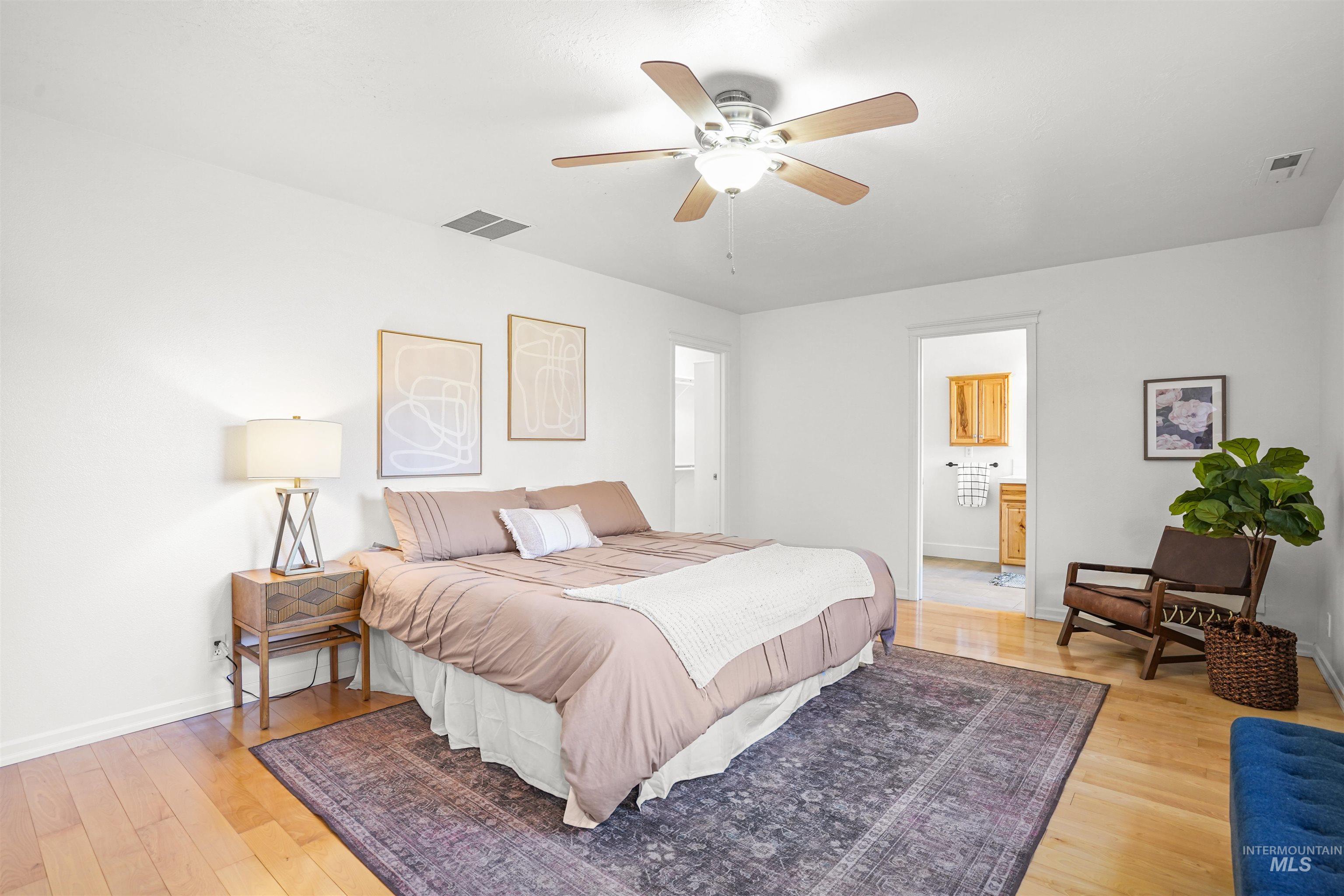 Bedroom featuring light wood finished floors and ceiling fan