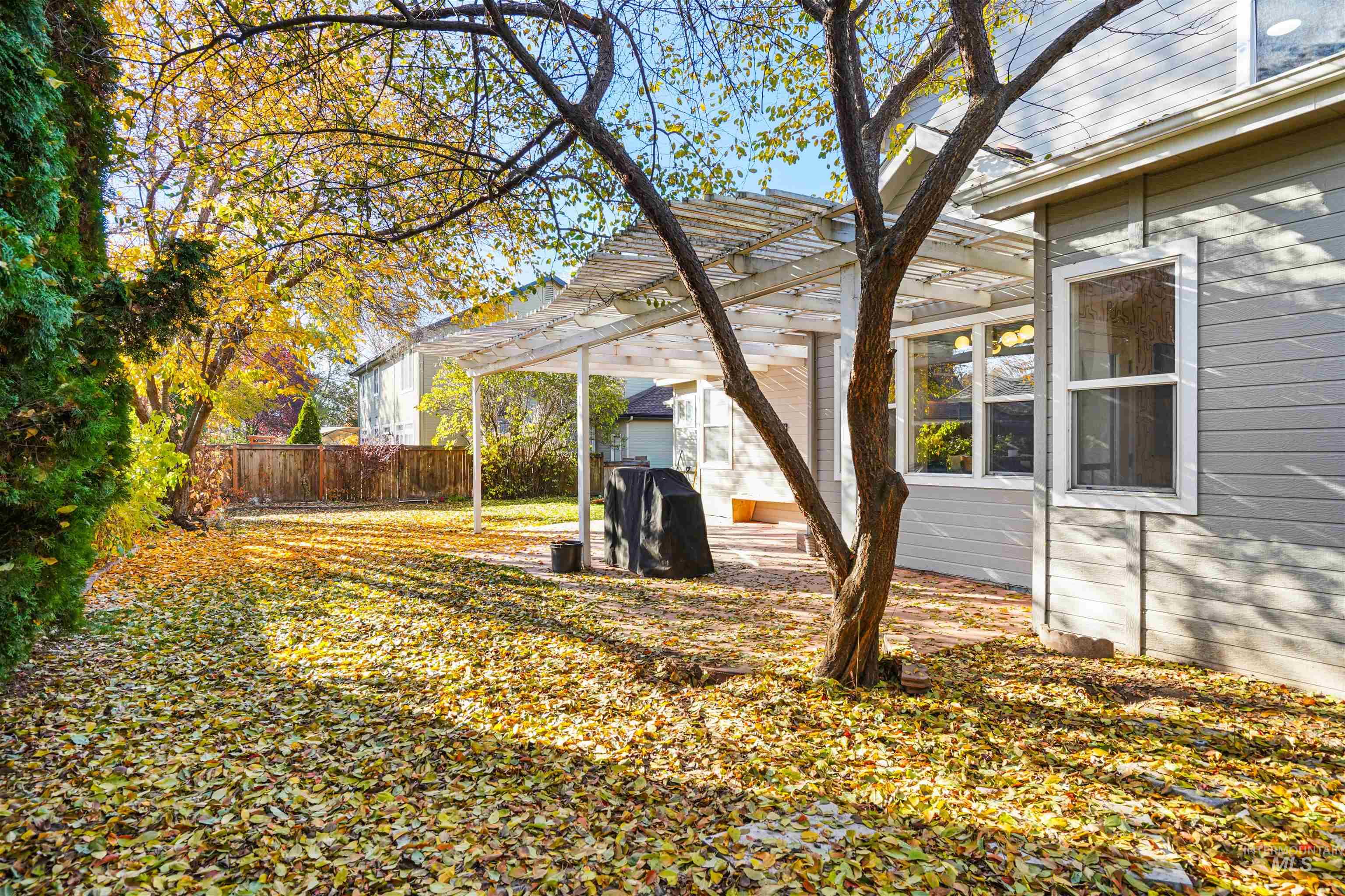 View of yard with a pergola and a patio area