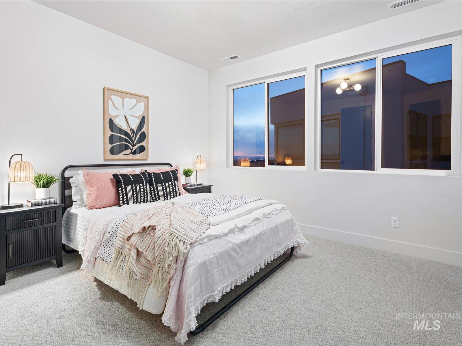 Carpeted bedroom featuring baseboards