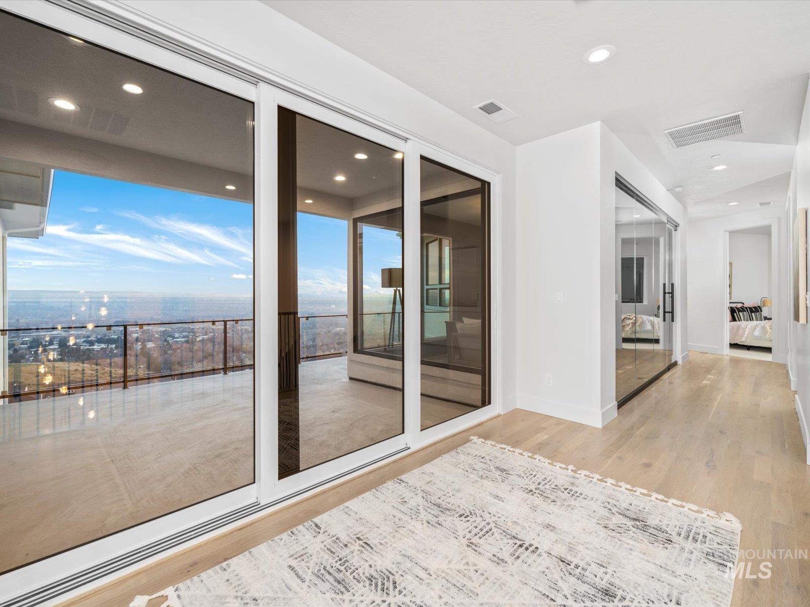 Unfurnished room with light wood-style flooring and recessed lighting