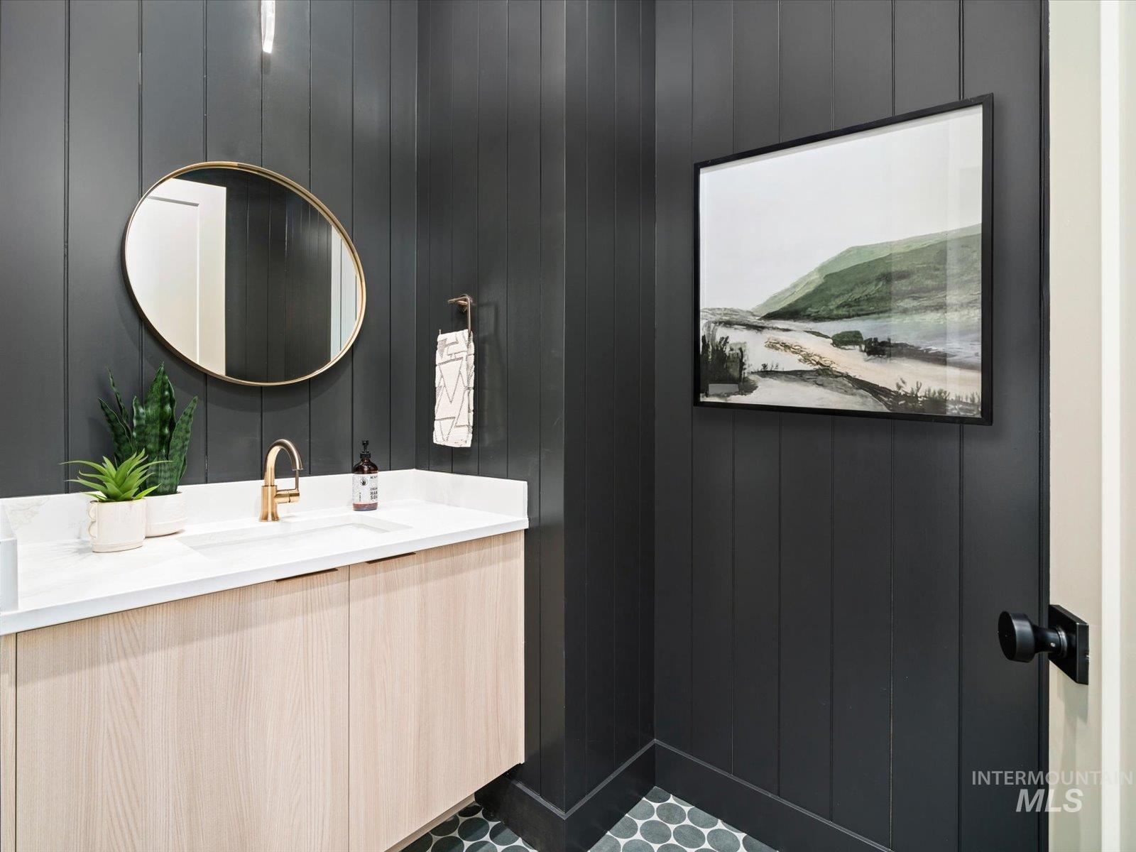 Bathroom featuring vanity and wooden walls