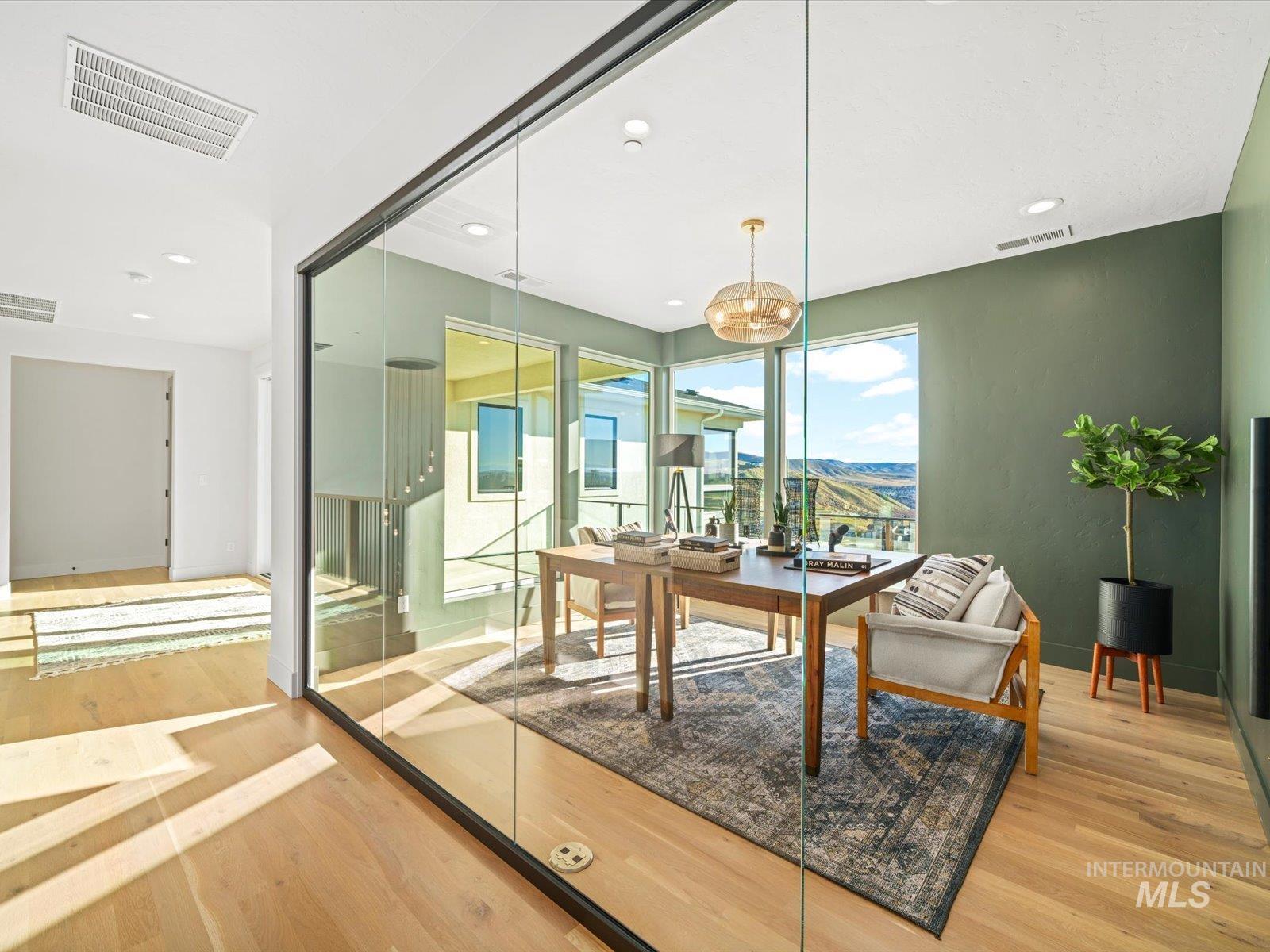 Dining space featuring a desk, light wood-type flooring, and recessed lighting