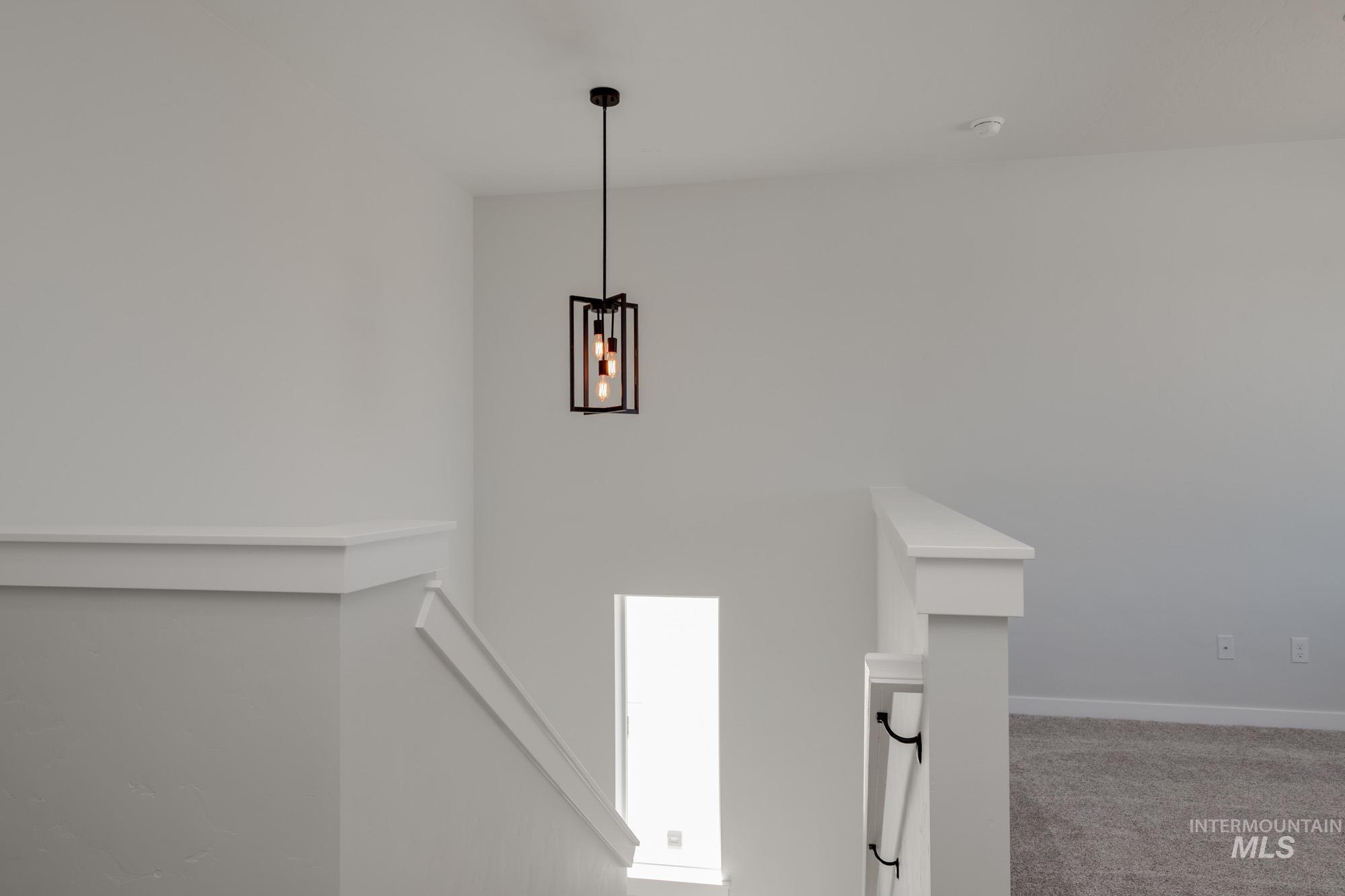 Detailed view of carpet and baseboards