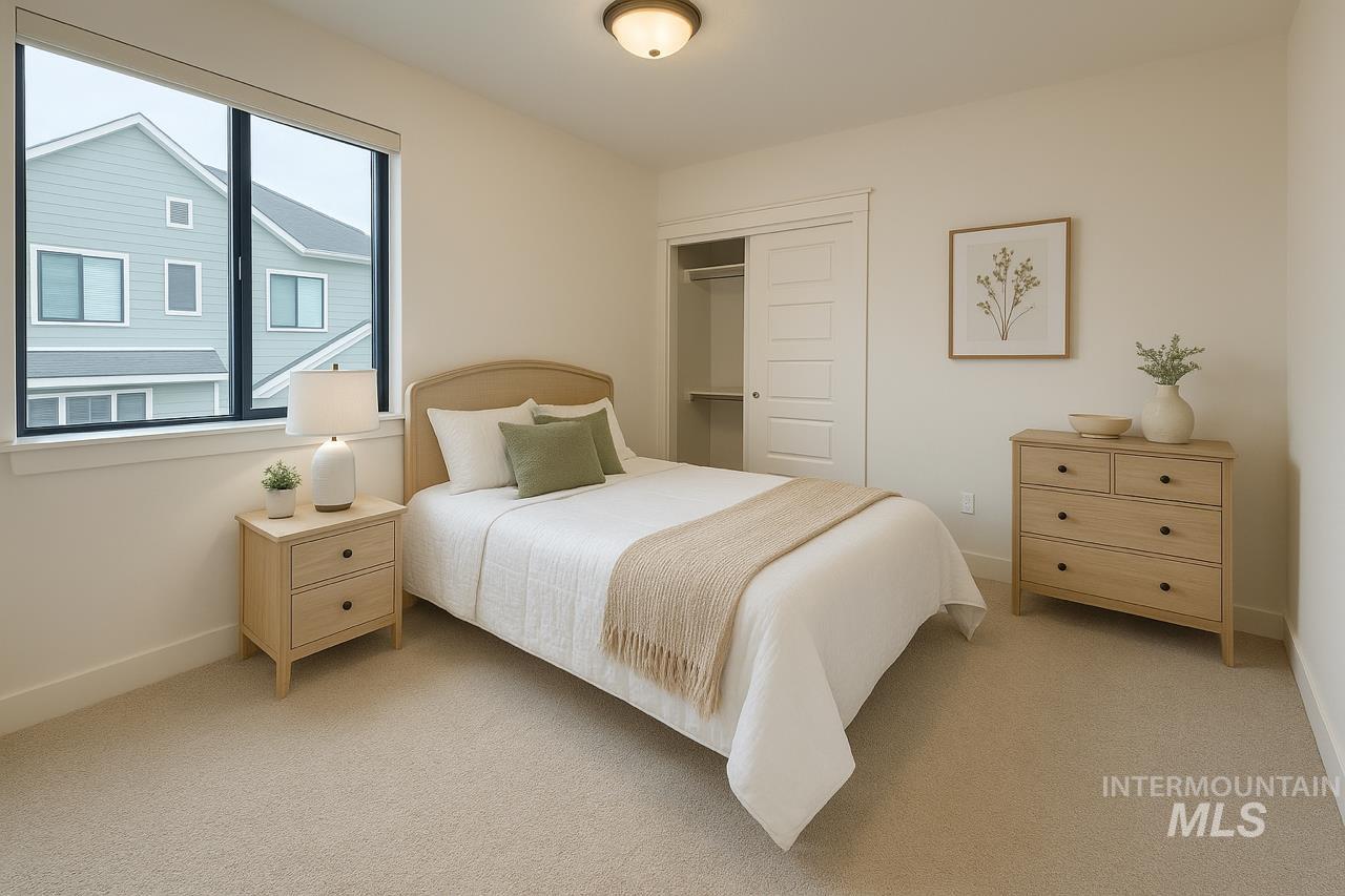 Bedroom featuring a closet and carpet floors