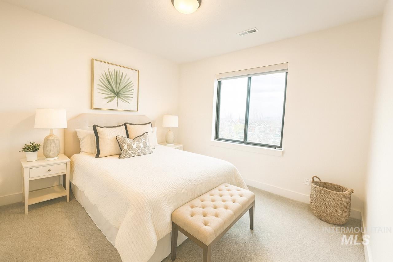 Carpeted bedroom with baseboards