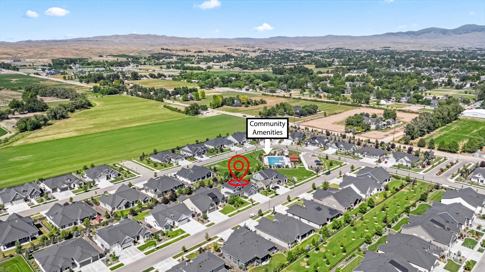 Aerial perspective of suburban area with a mountain backdrop