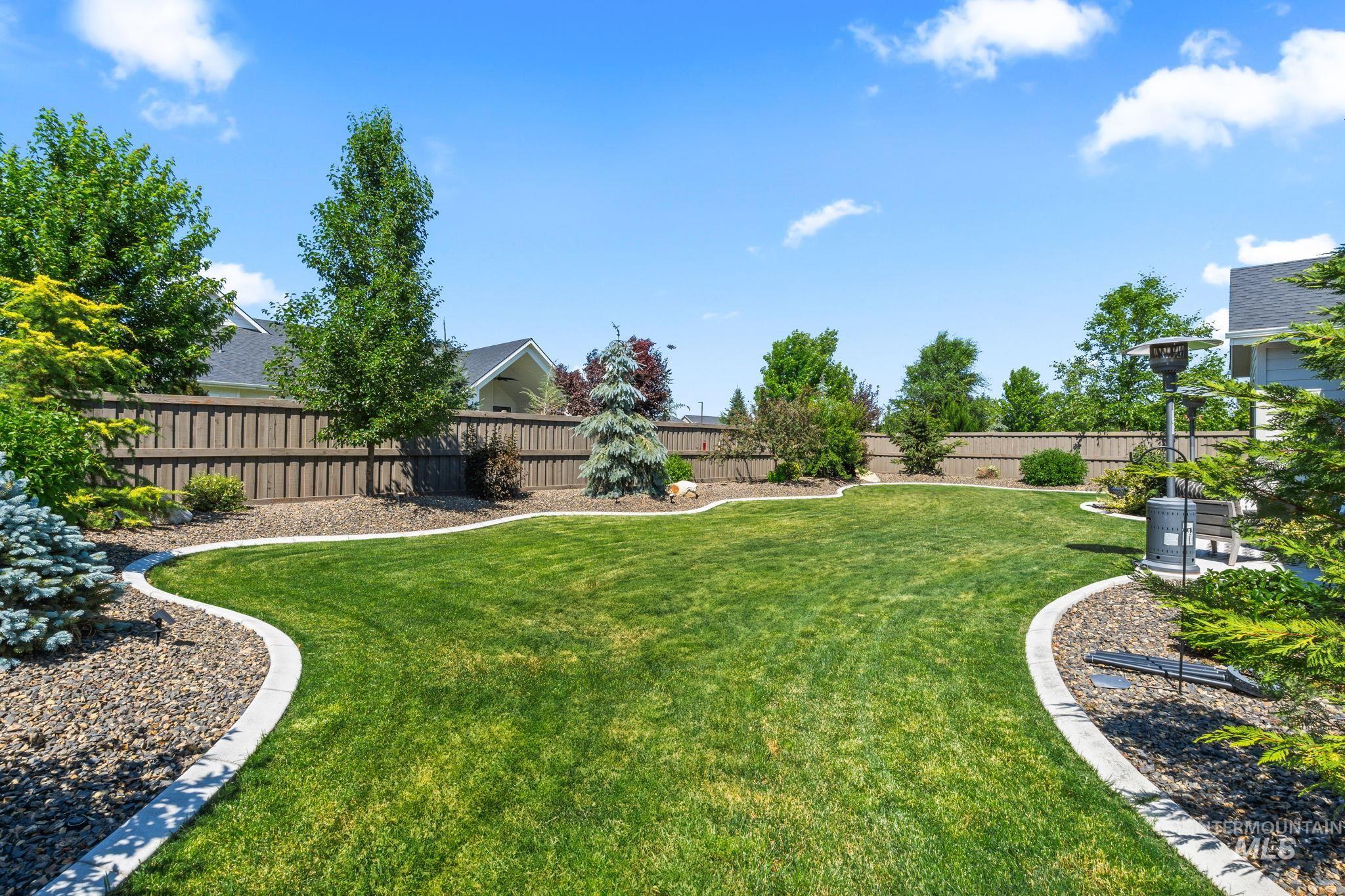 View of fenced backyard