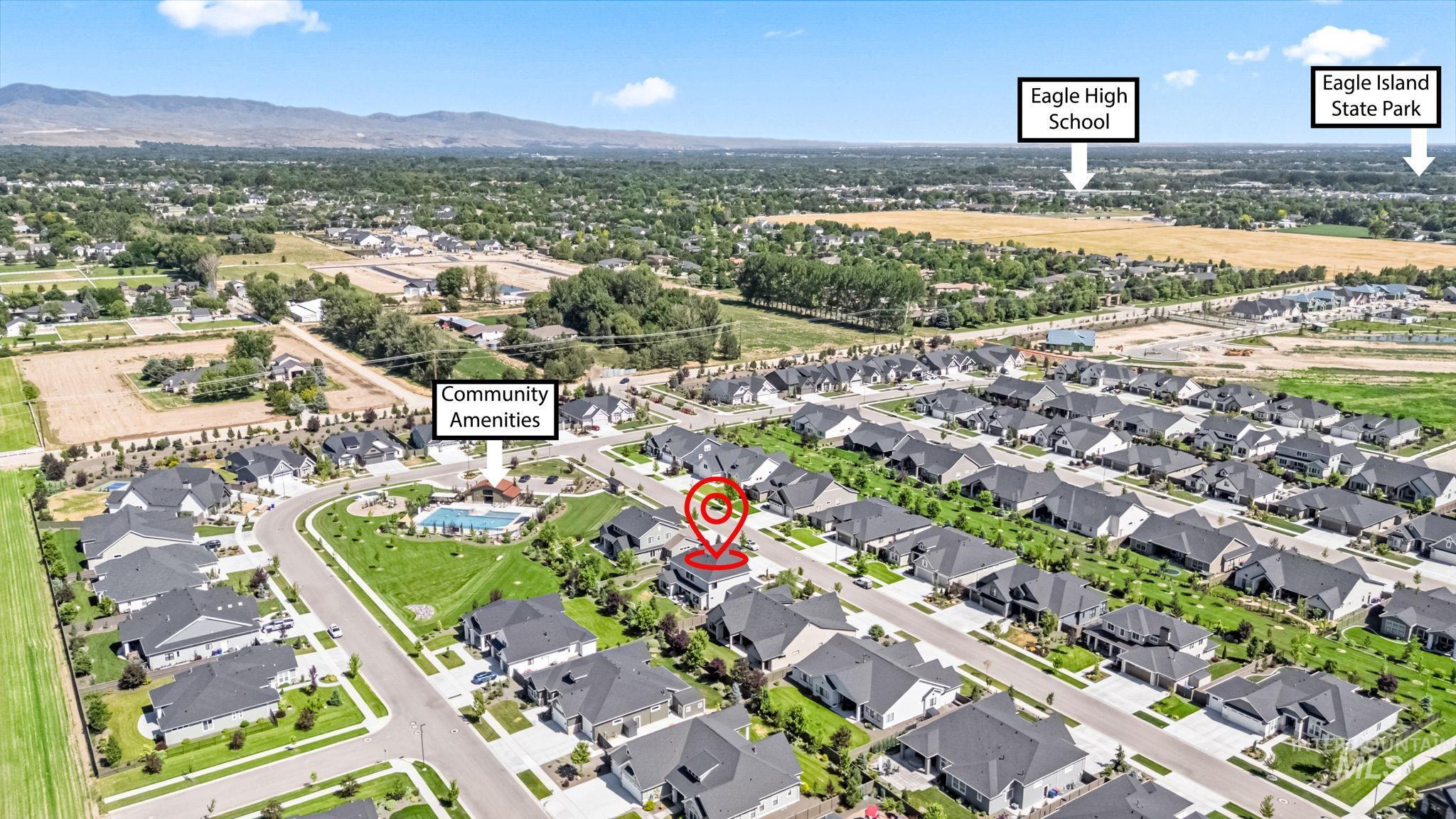 Aerial overview of property's location featuring nearby suburban area