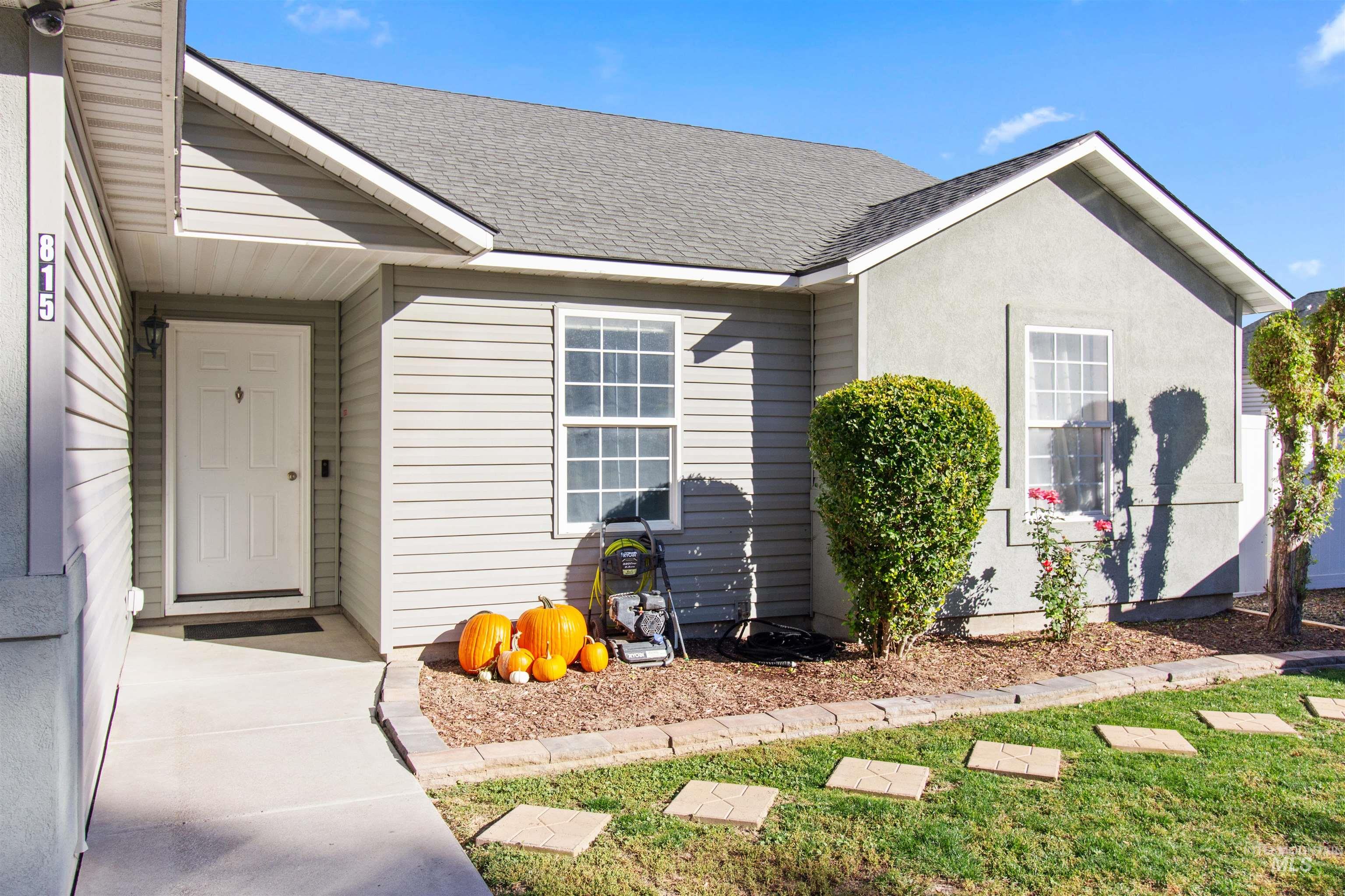 Entrance to property featuring a shingled roof