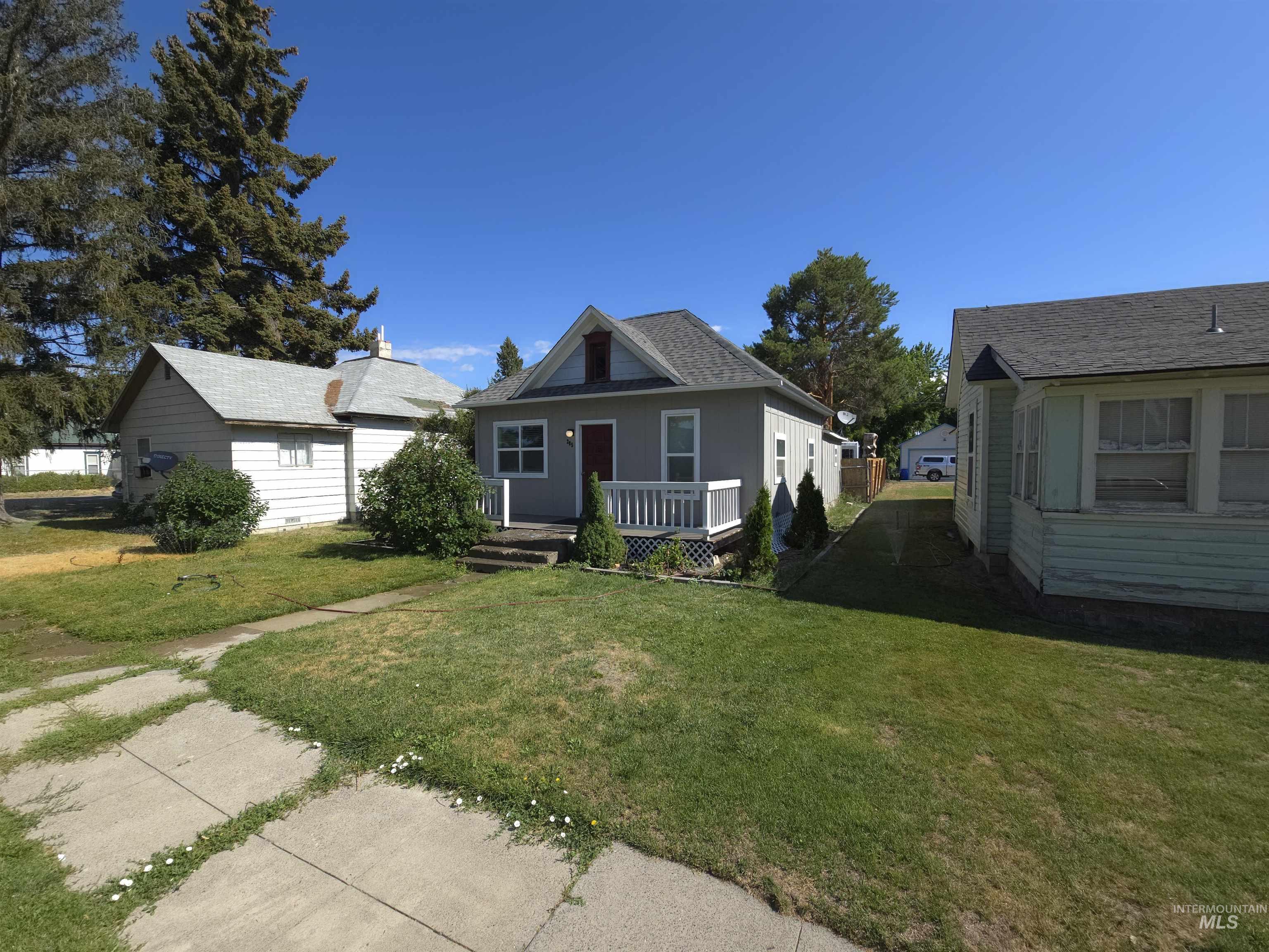 Bungalow-style house featuring a front yard and covered porch