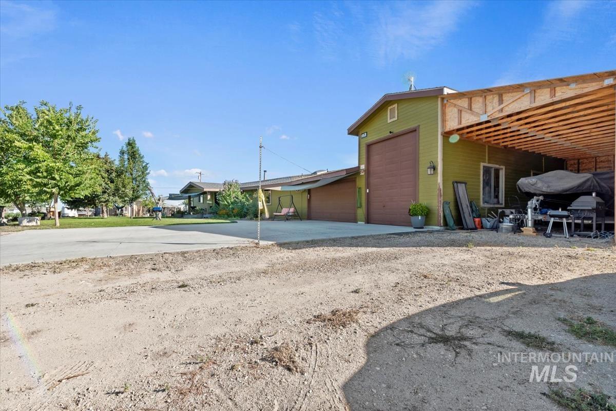 Back of house with driveway