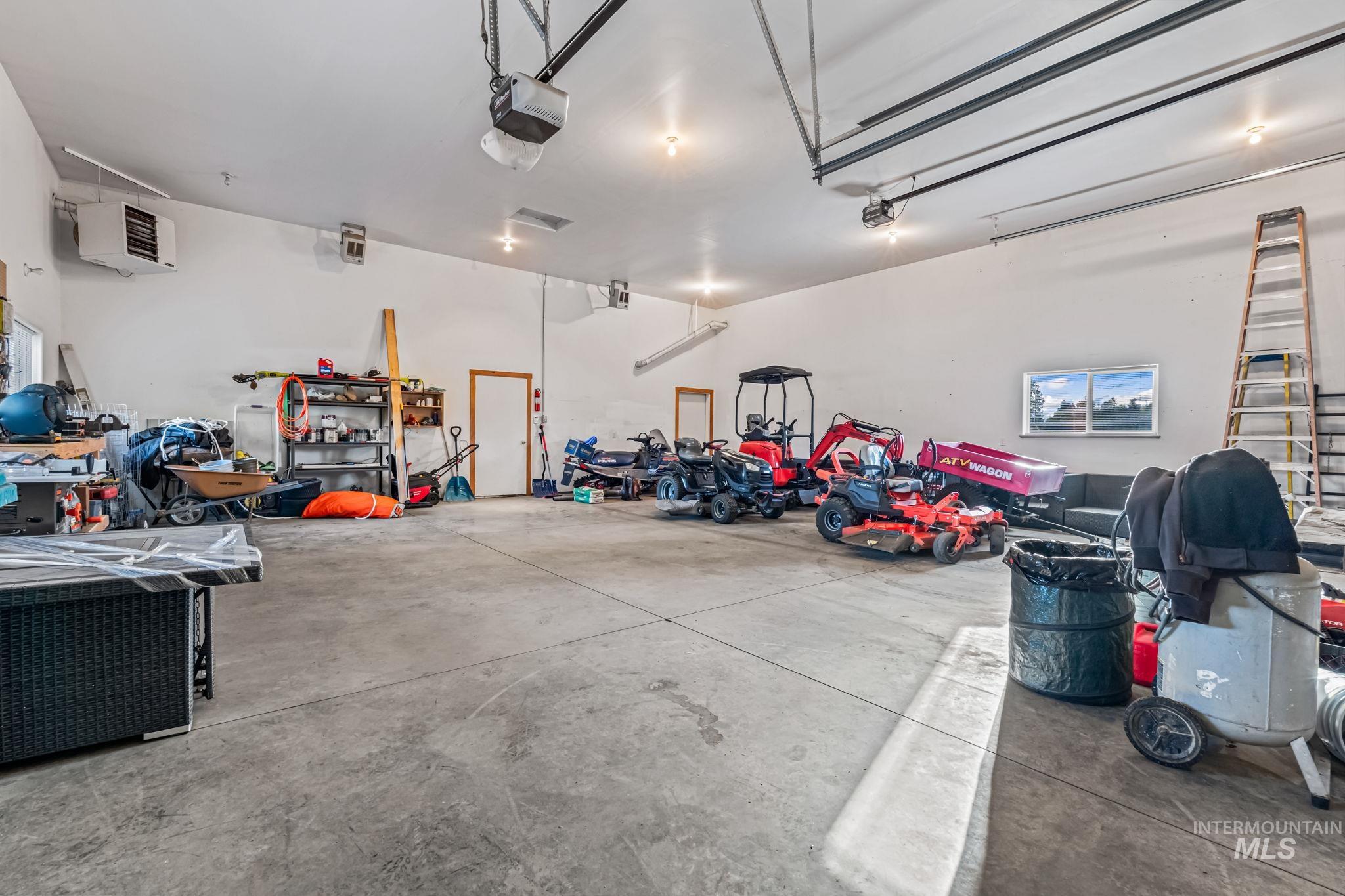 Garage with a heating unit and a garage door opener