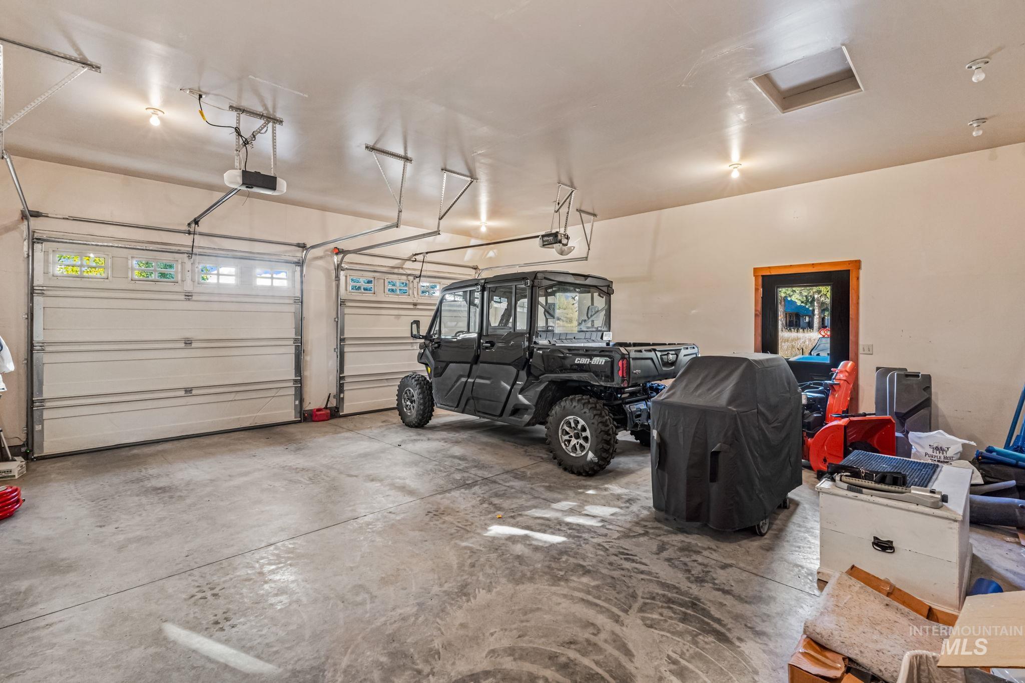 Garage featuring a garage door opener