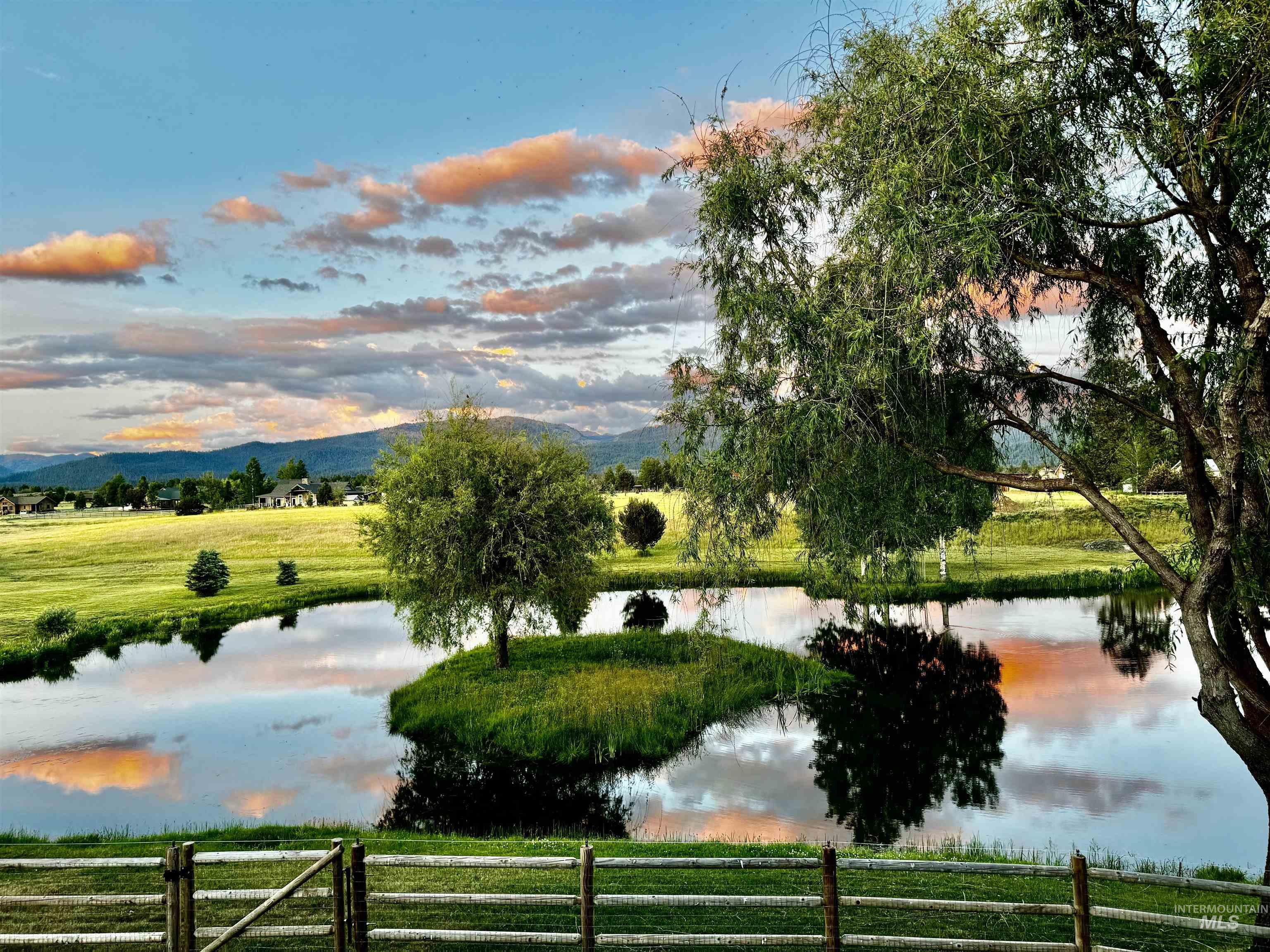 Surrounding community featuring a water and mountain view