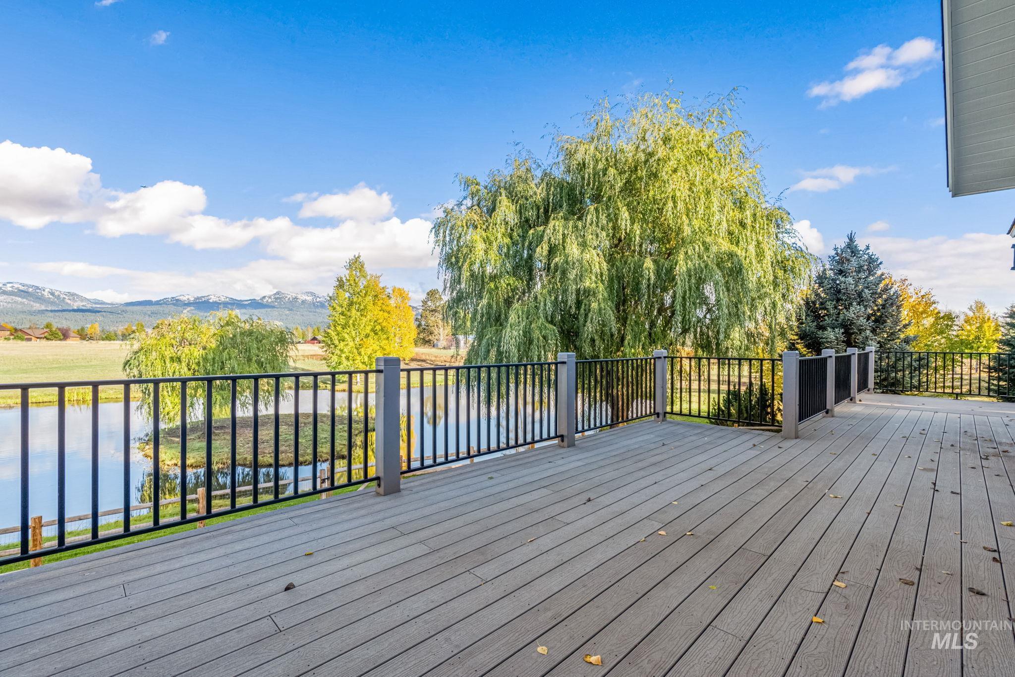Wooden deck featuring a water view