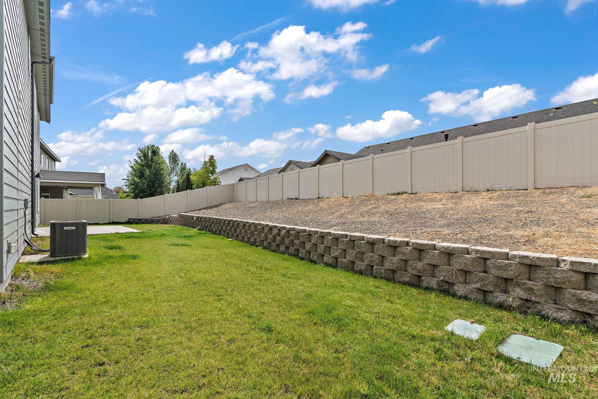 View of fenced backyard