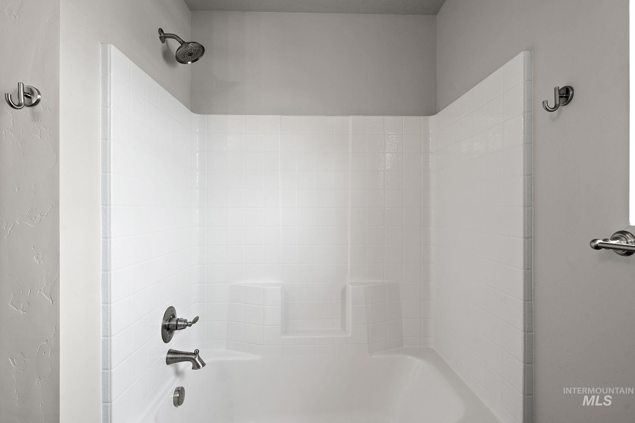 Bathroom with bathing tub / shower combination