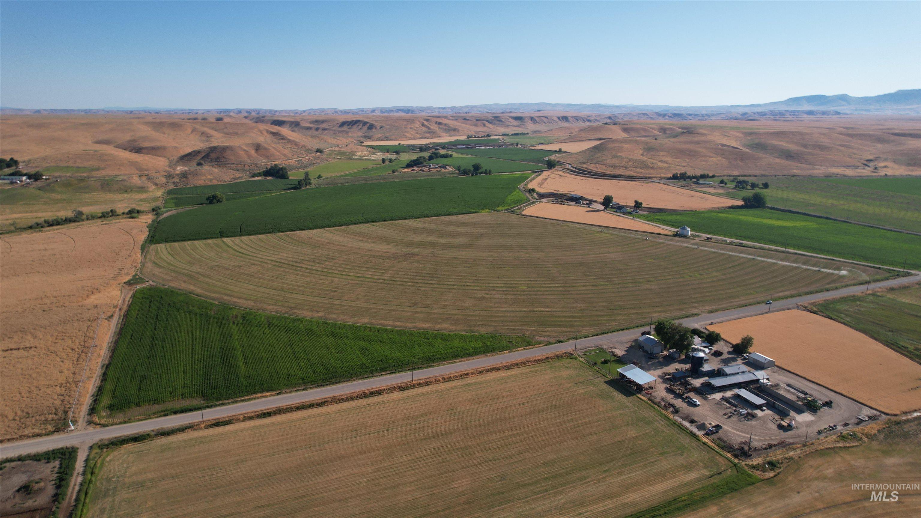 Aerial view of property's location with rural landscape and extensive farmland