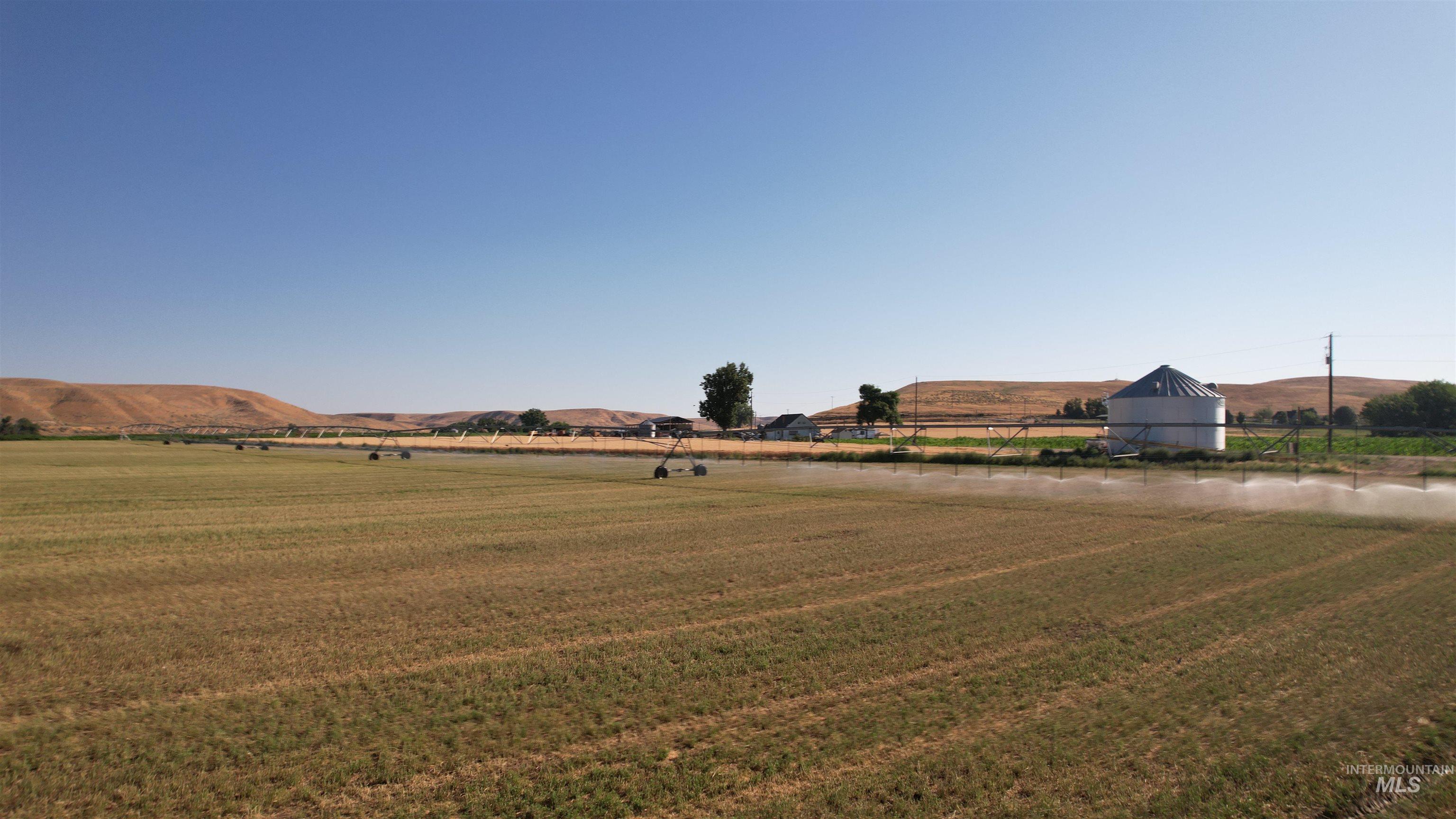 View of green lawn featuring a view of countryside and a mountain view