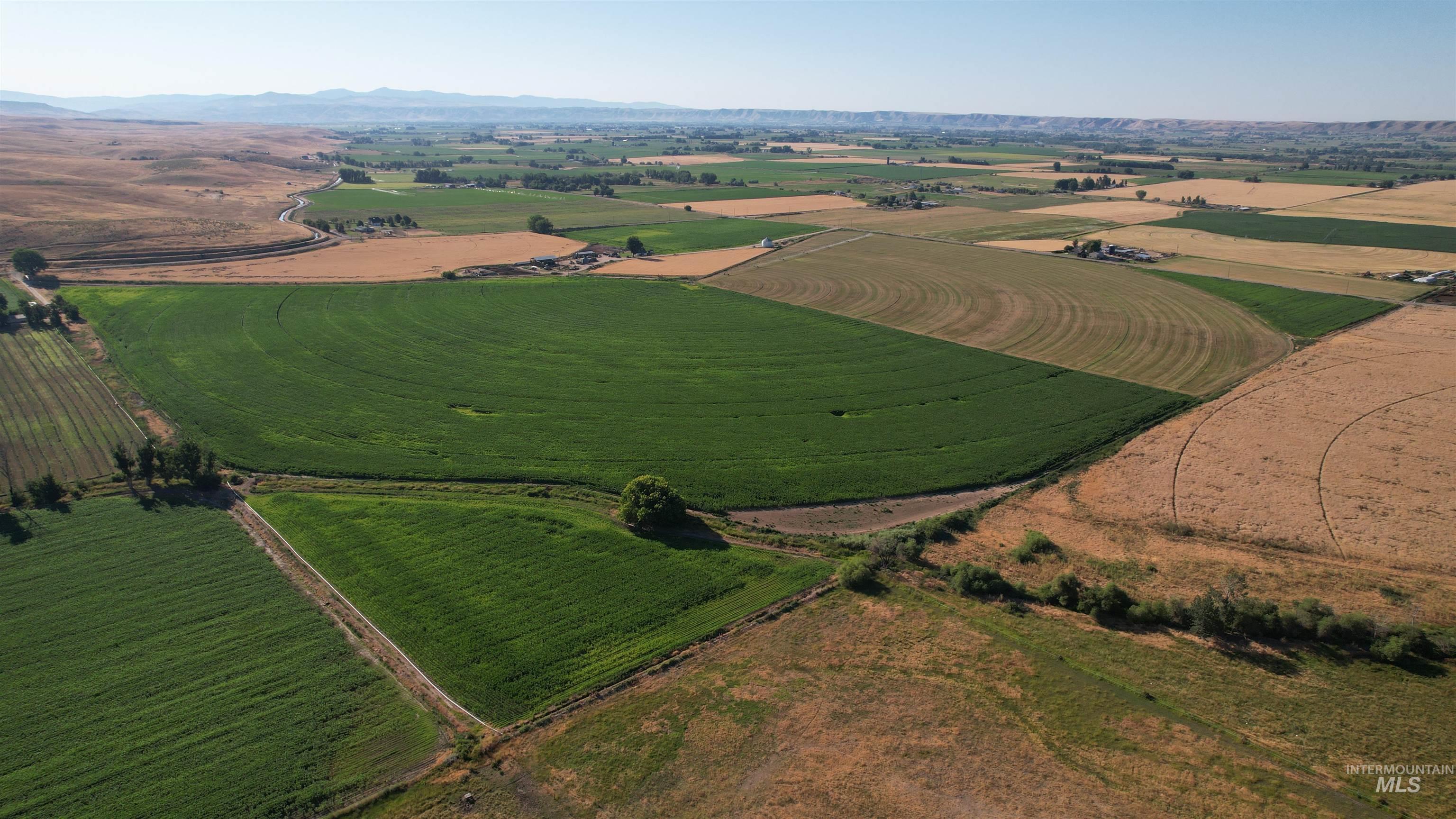 Aerial view of property's location featuring rural landscape and large plots for crops