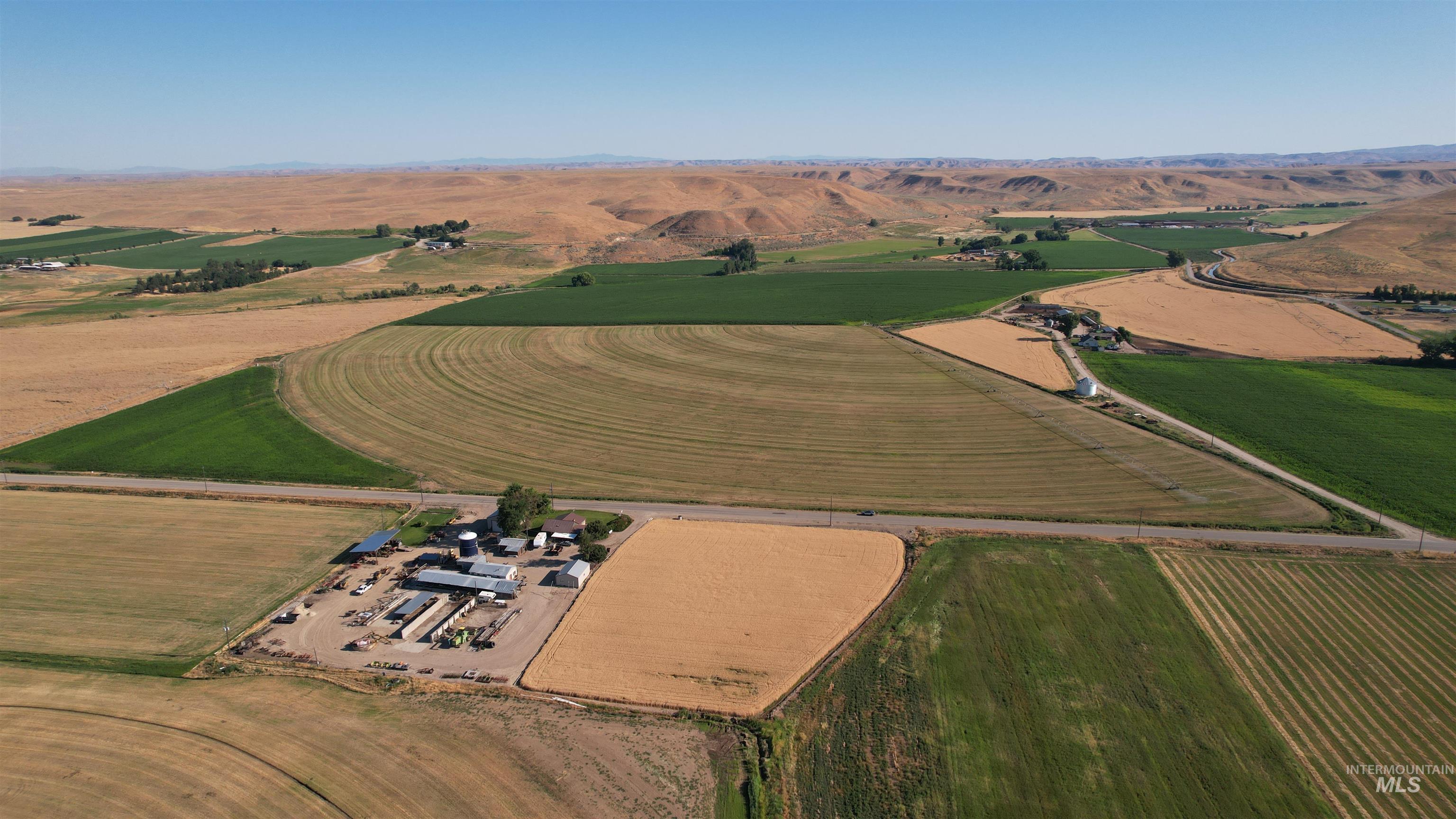 Aerial view of property and surrounding area with rural landscape