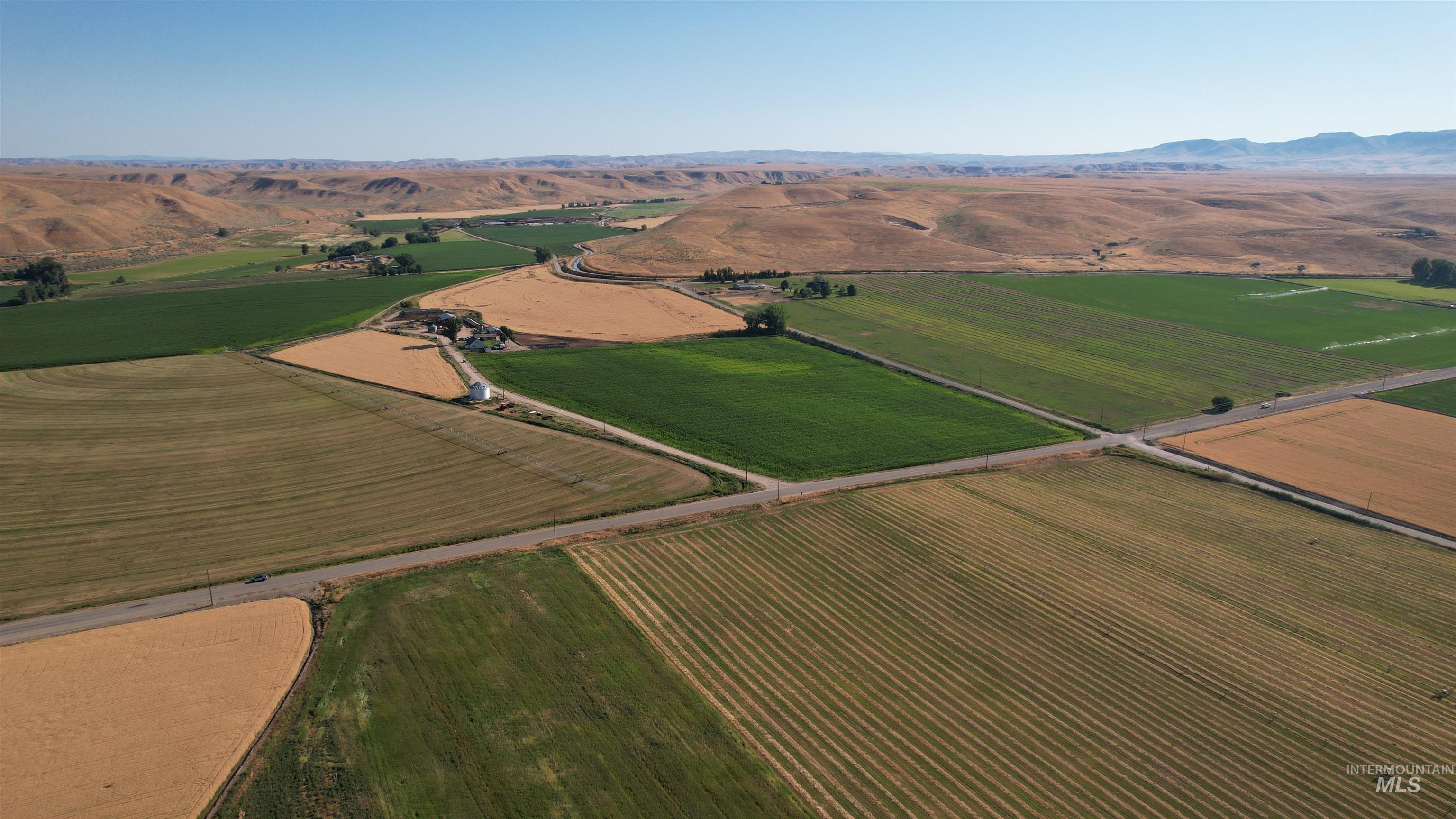 Aerial overview of property's location with rural landscape and extensive farmland