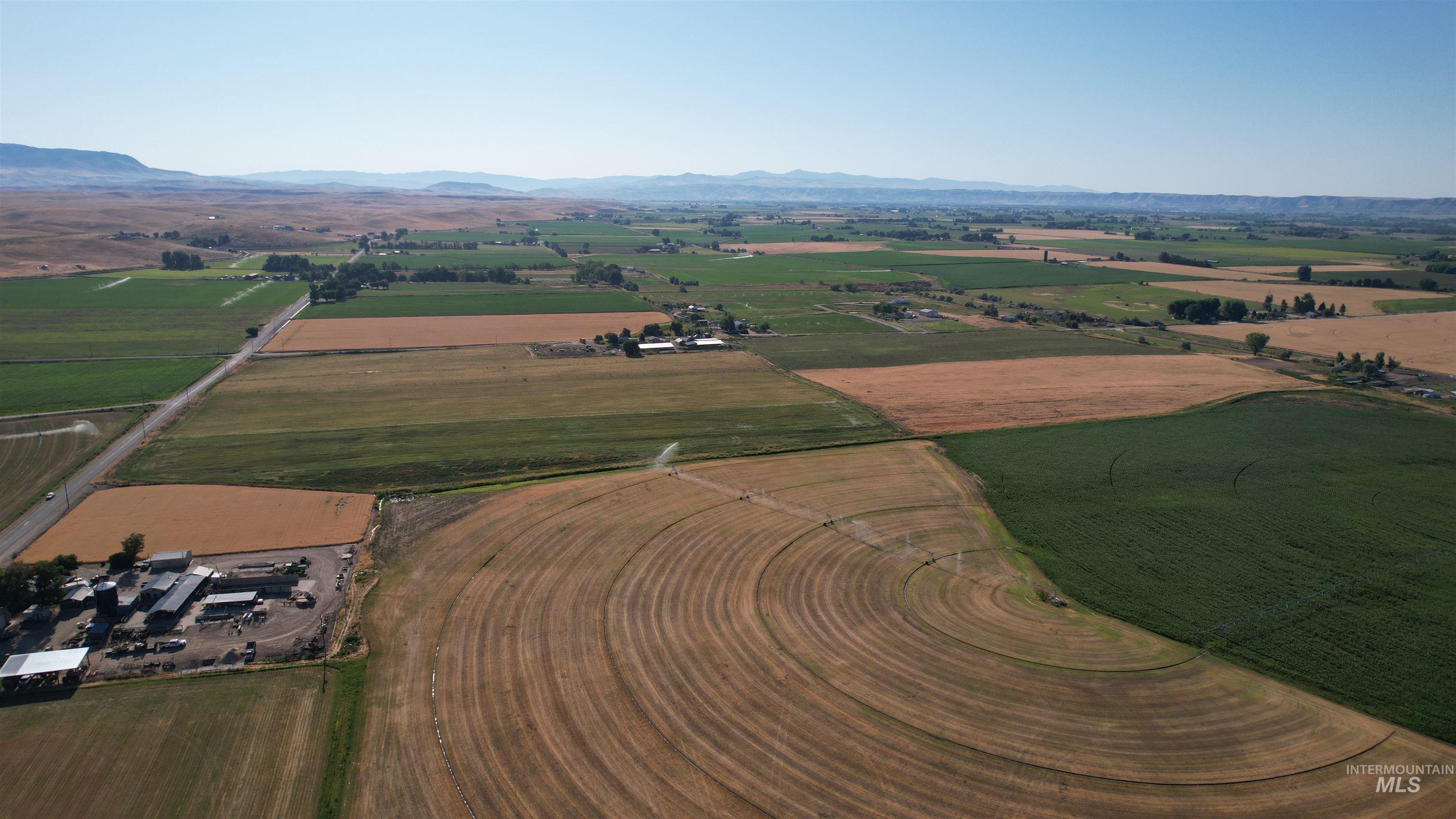 Aerial view of property and surrounding area with rural landscape and mountains