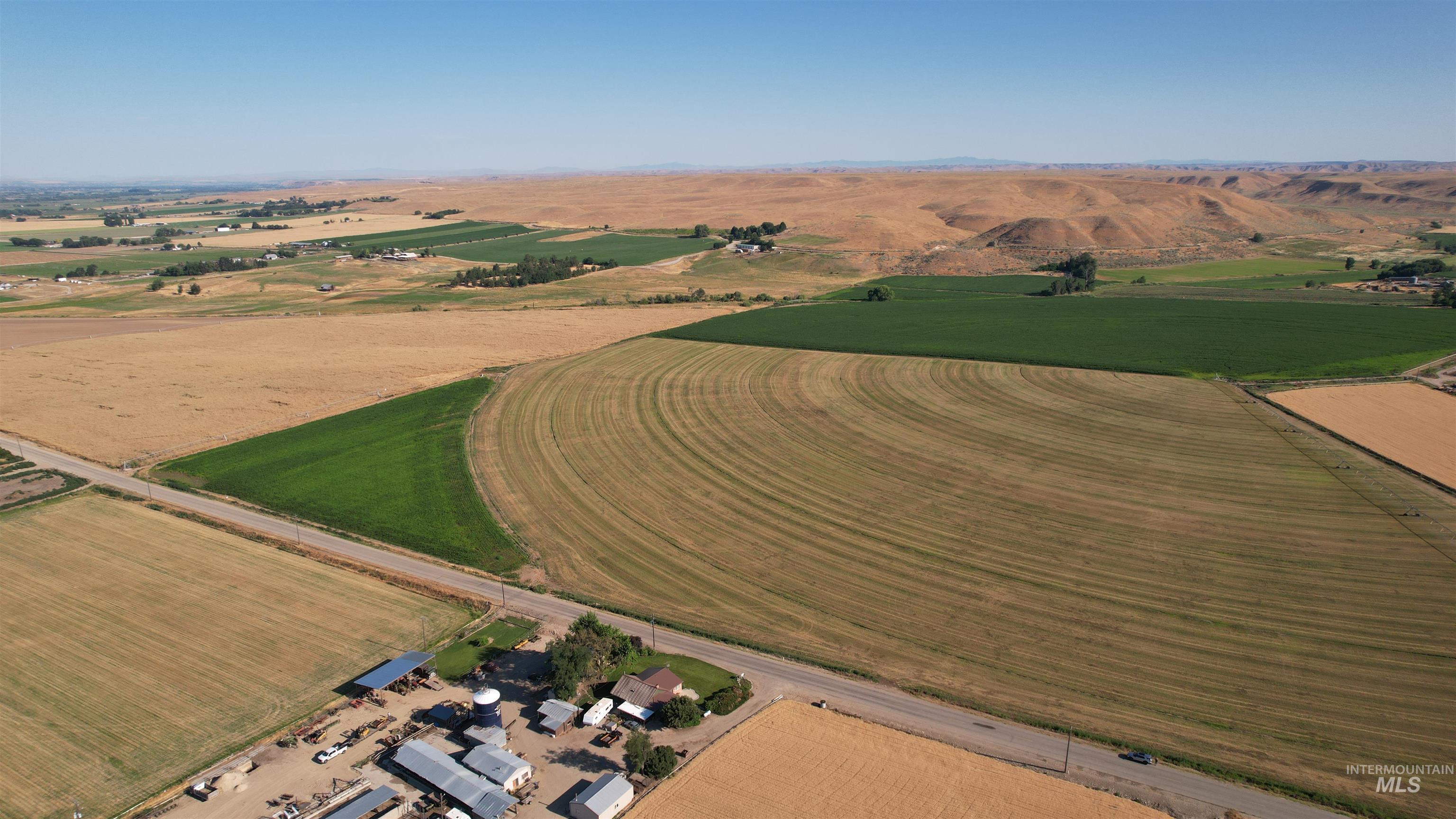Aerial view of property's location with rural landscape and farmland